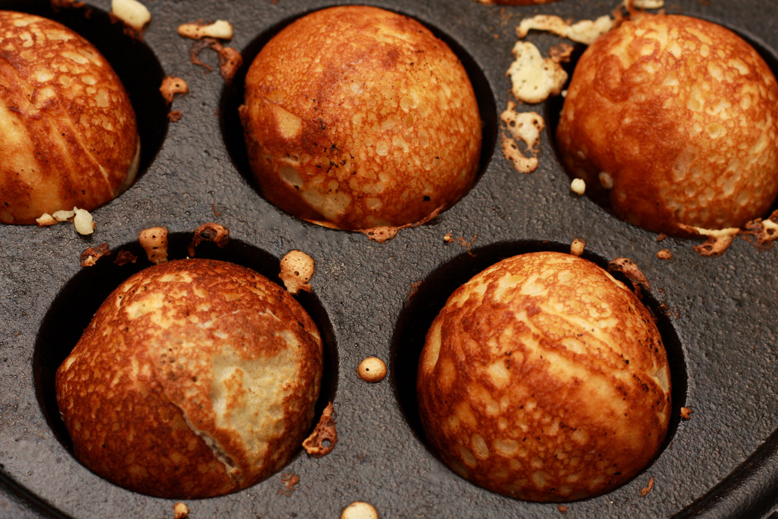 round aebleskiver in a pan