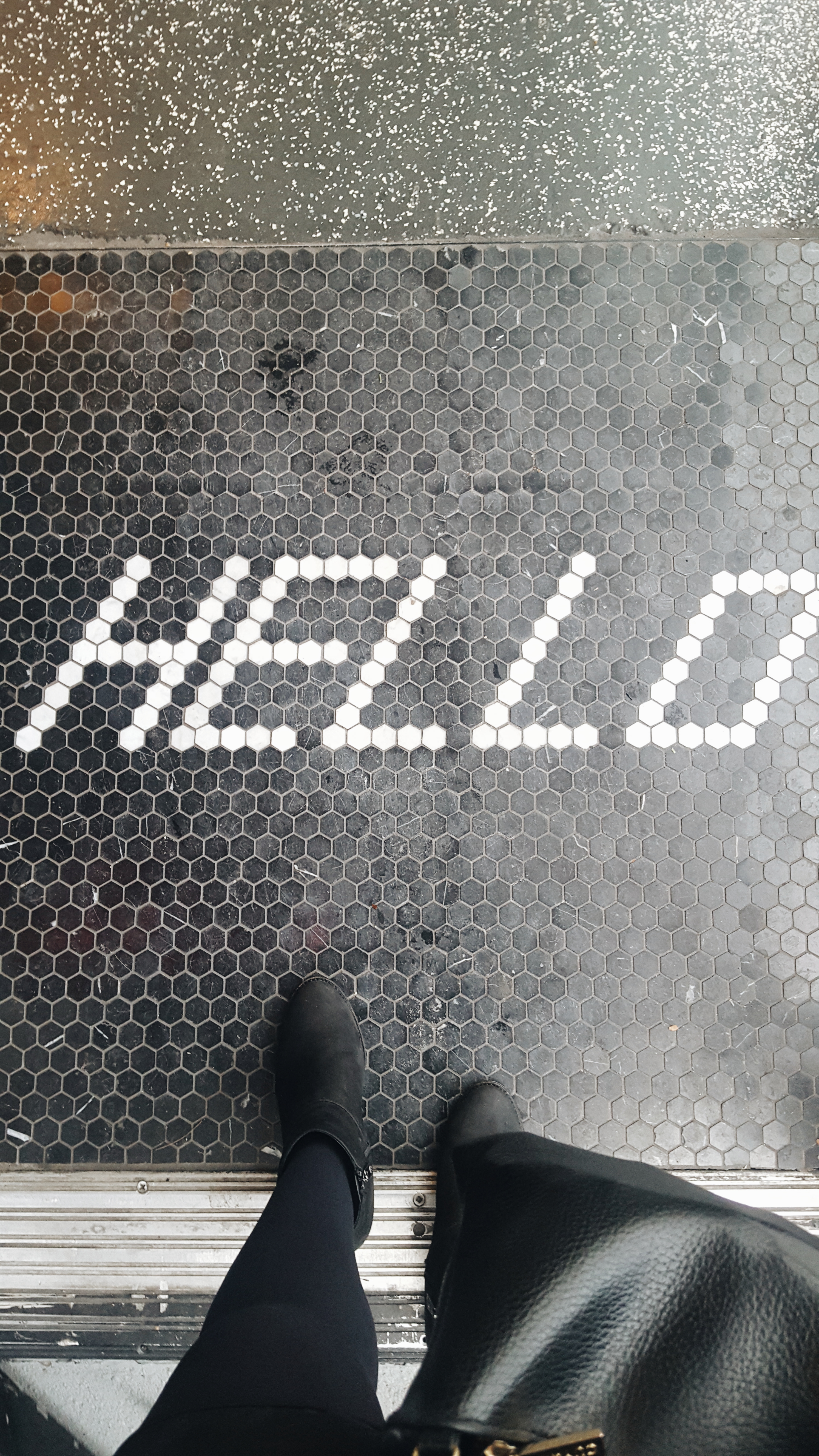 Bandit's tile mat that reads "HELLO"