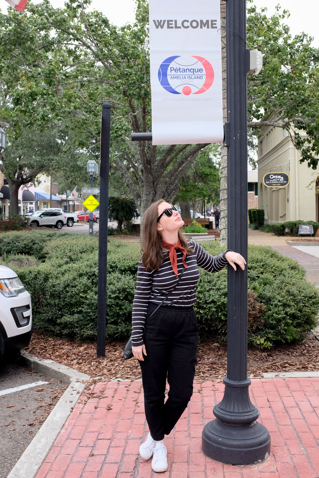 standing under petanque sign