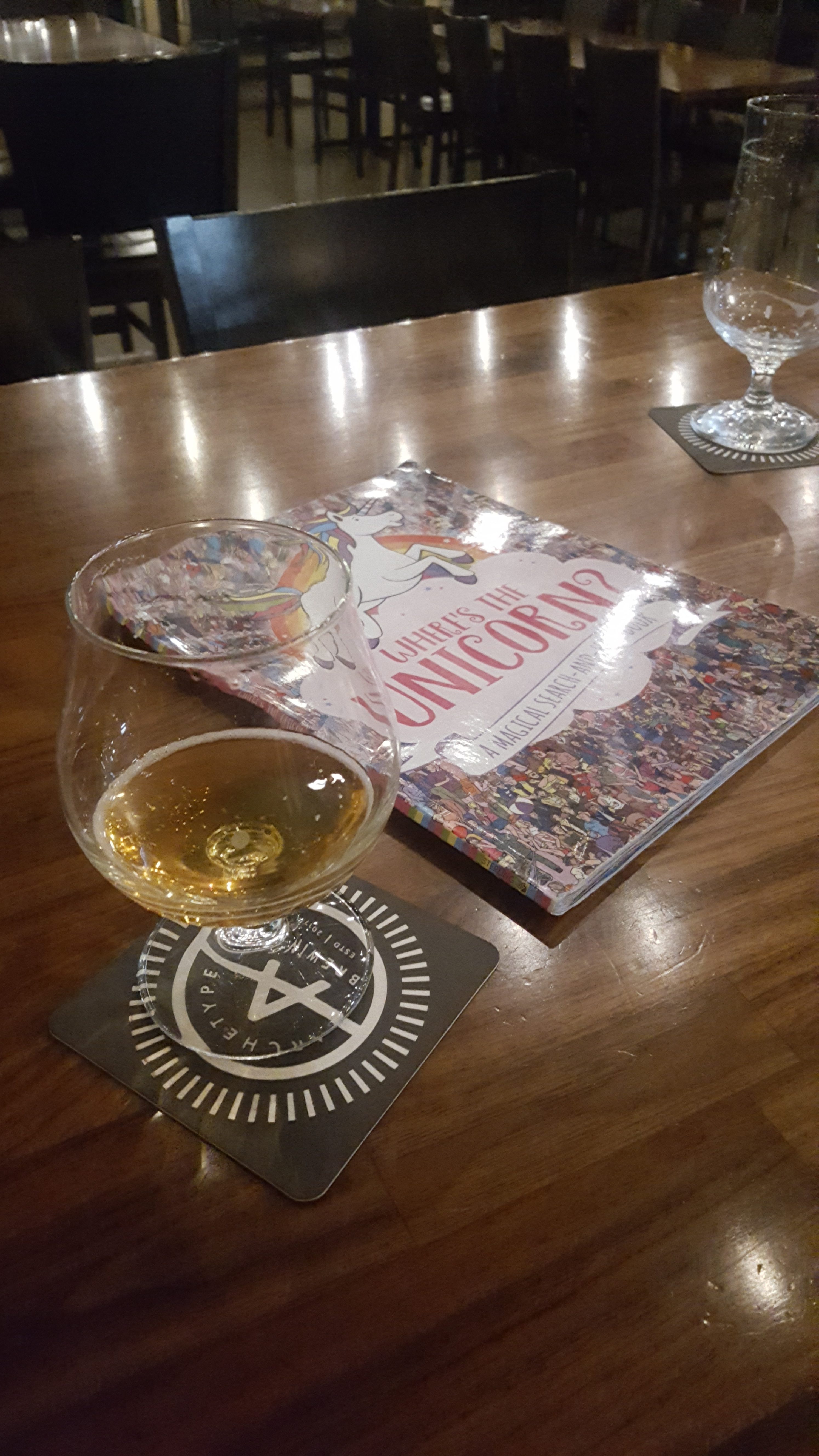 A coaster and a kid's book at Archetype Brewing in Asheville