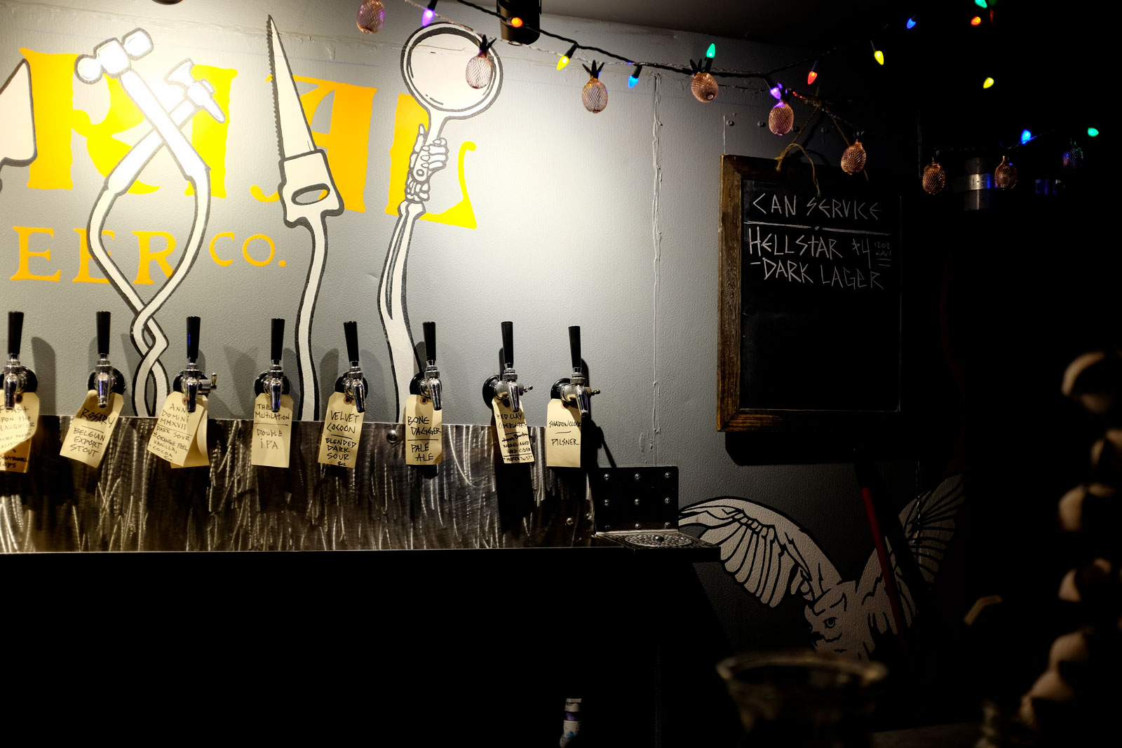 A row of beer taps at Burial Brewing Asheville