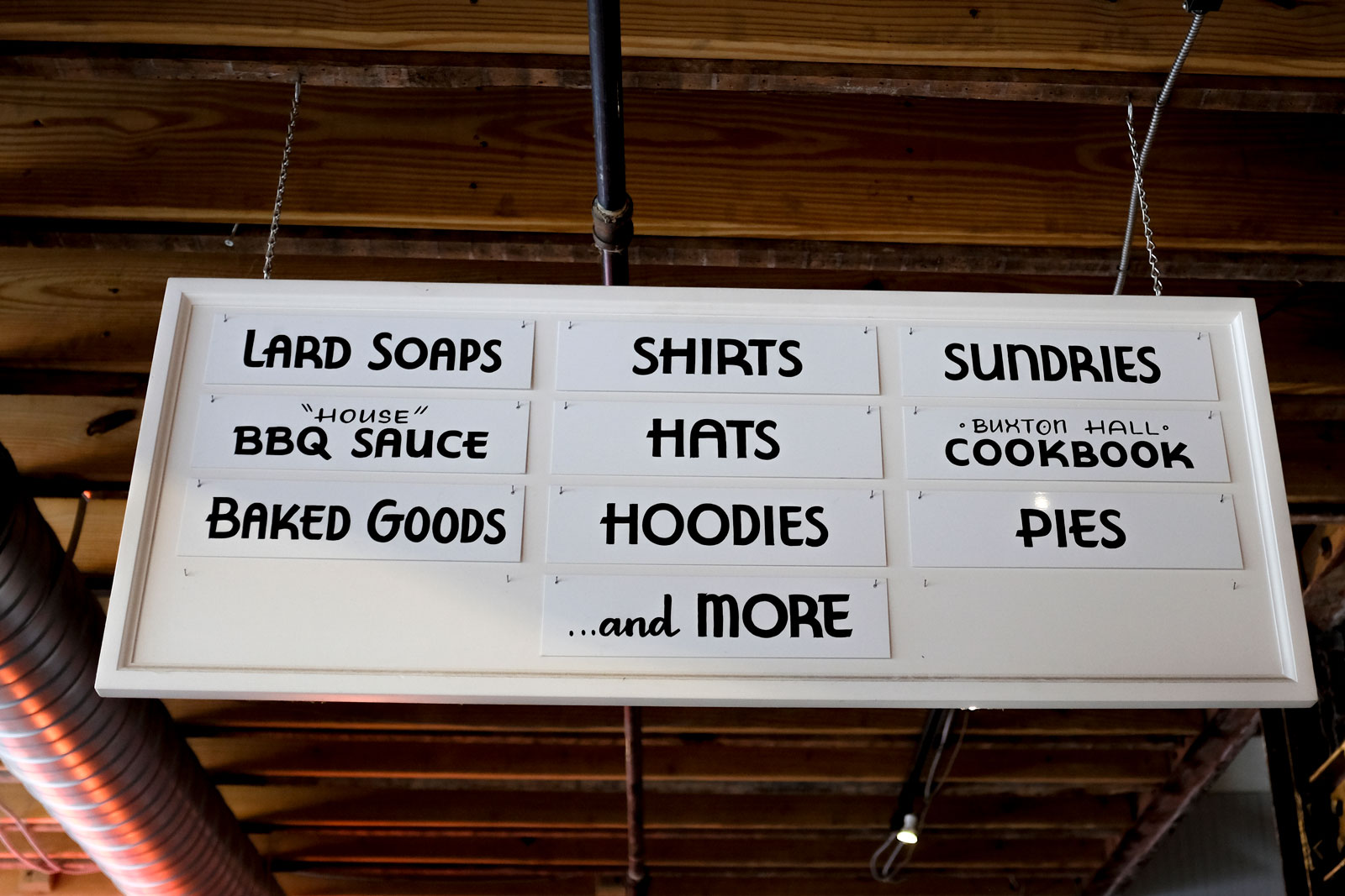 A vintage inspired sign for Buxton Hall BBQ's retail offerings