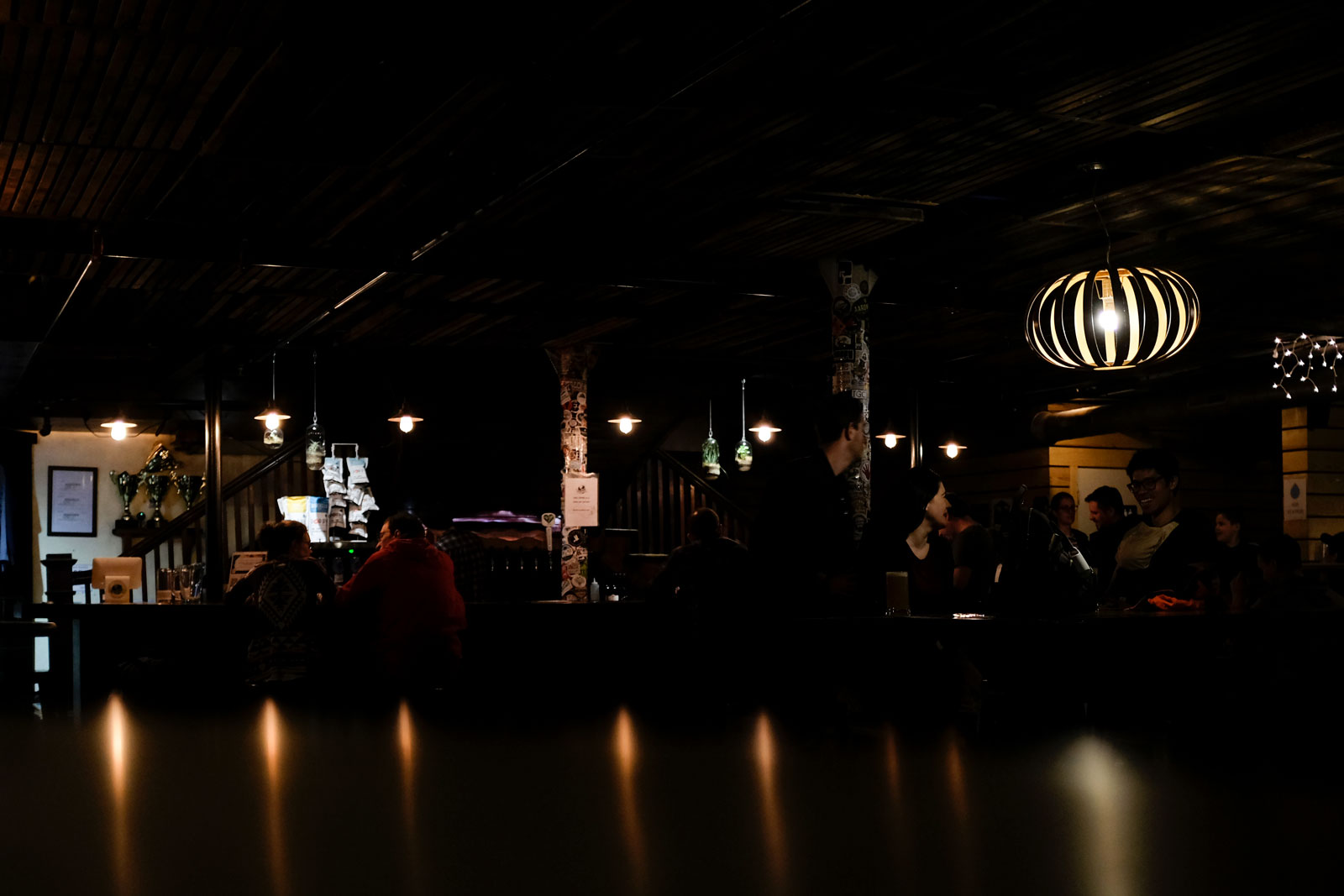 The dark interior of Asheville's One World Brewing