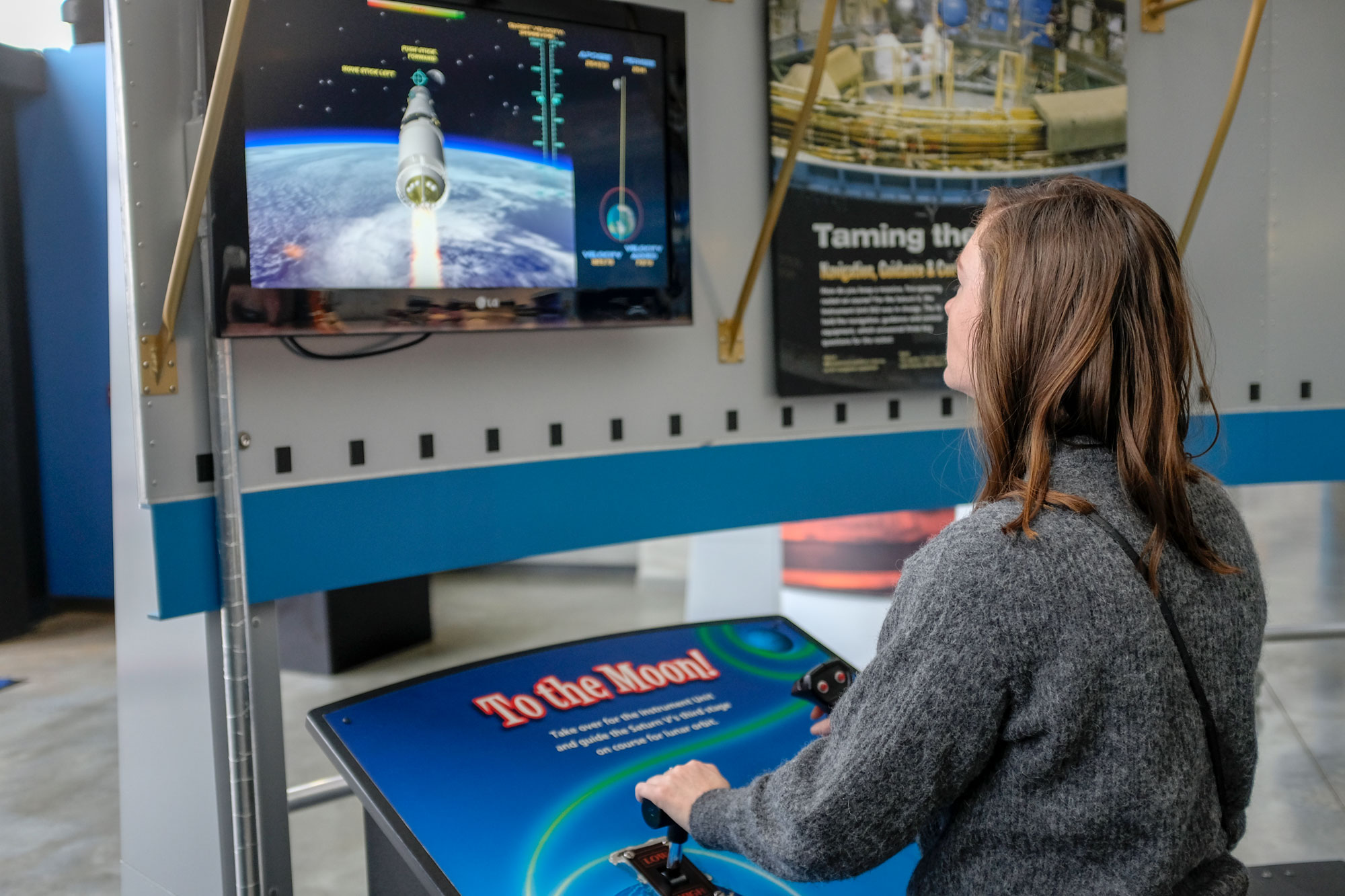 Alyssa fiddles with an interactive exhibit at the U.S. Space & Rocket Center