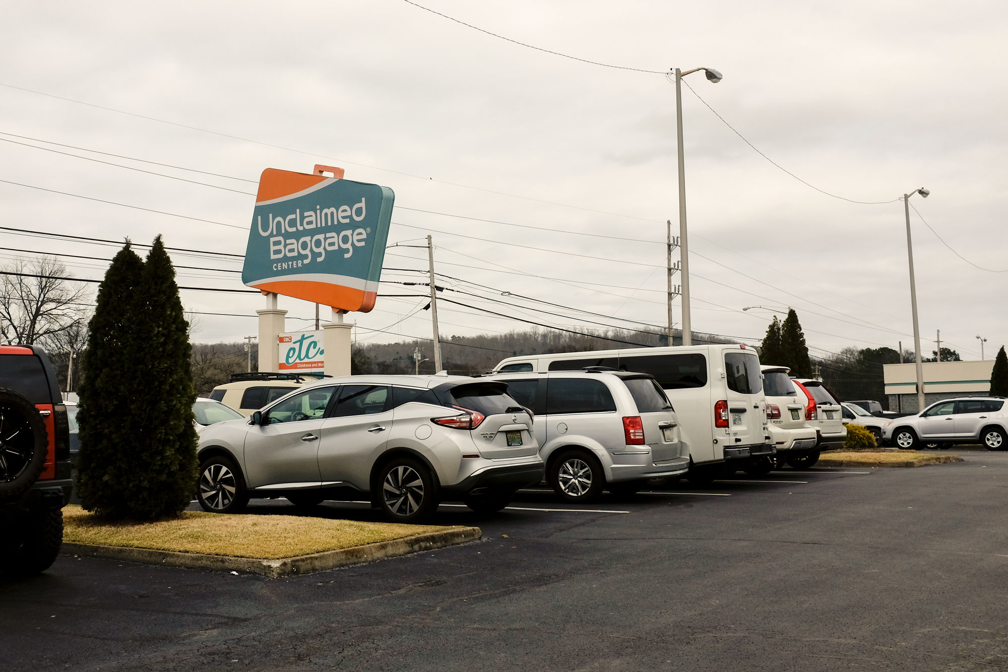 View of Unclaimed Baggage parking lot and street sign