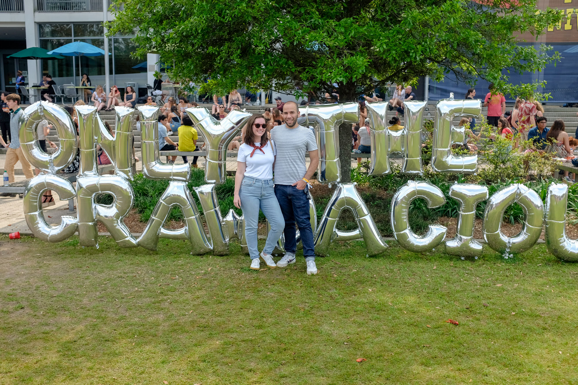 Alyssa and Michael in front of a sign that says Only the Crawdacious