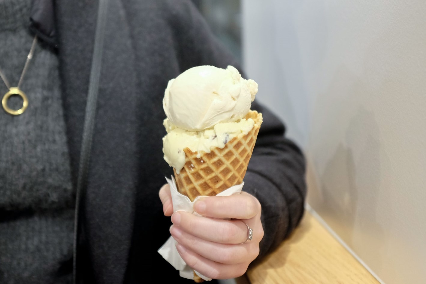 A close up of Alyssa holding an ice cream cone
