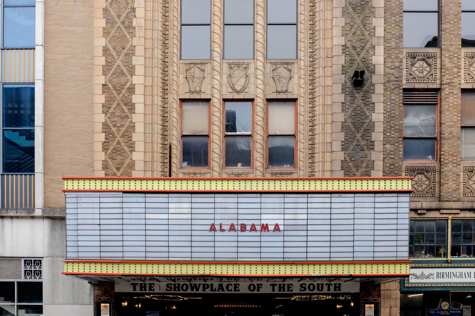 A photo of the Alabama Theatre. The marquee reads ALABAMA