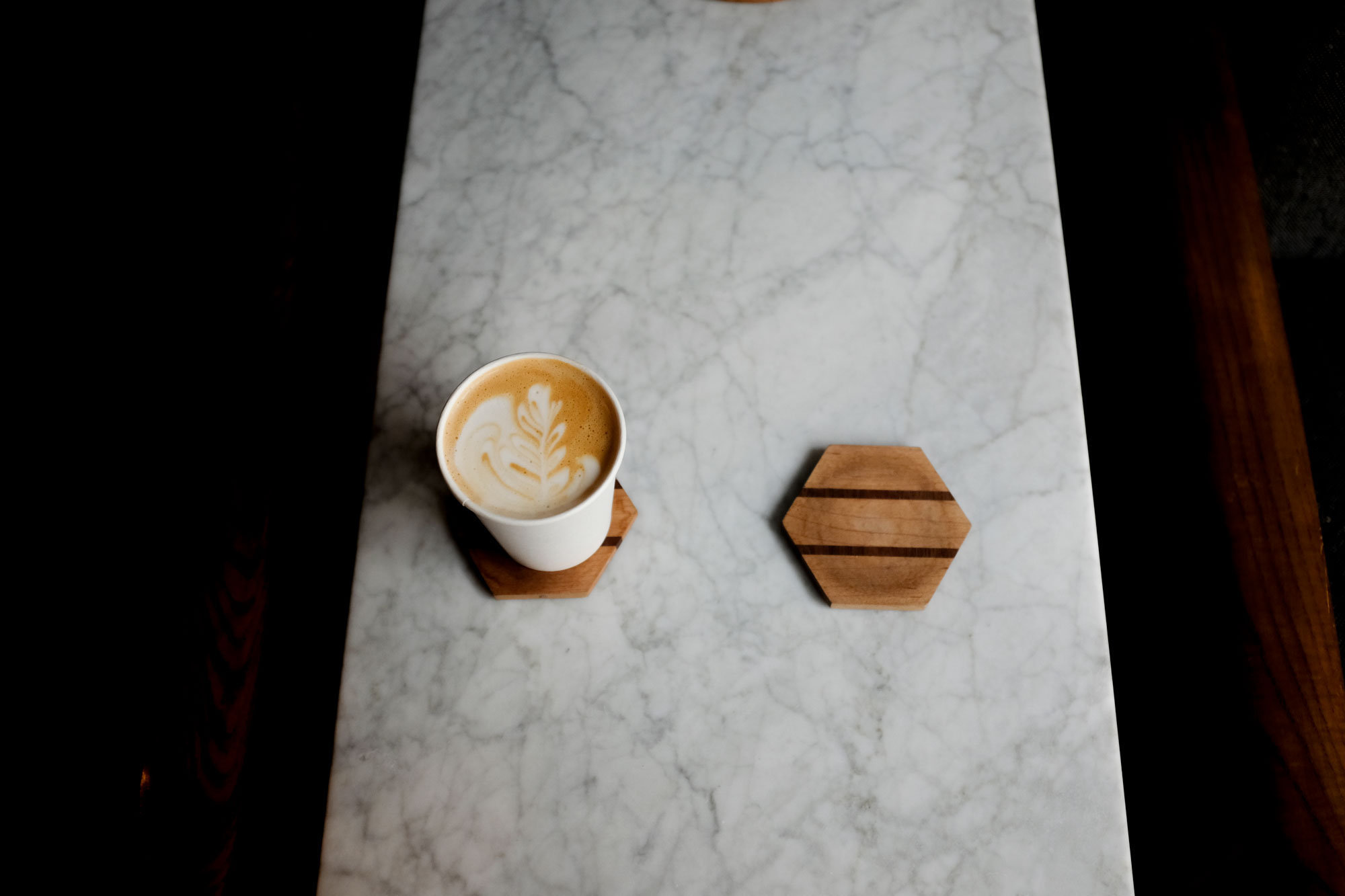 photo of two coasters at Revelator, one has a cappuccino on top