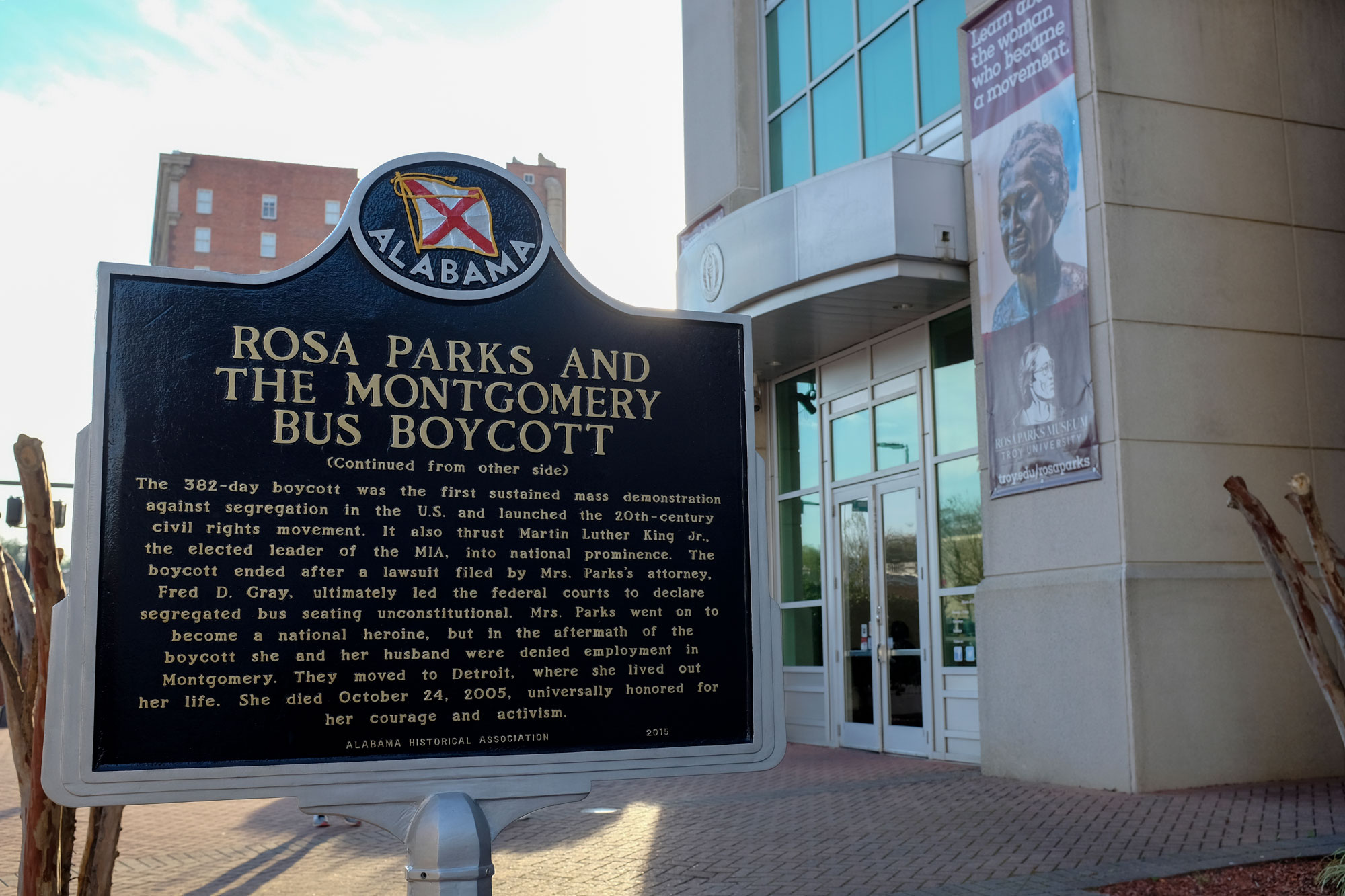 Exterior of Rosa Parks museum and sign explaining the bus boycott