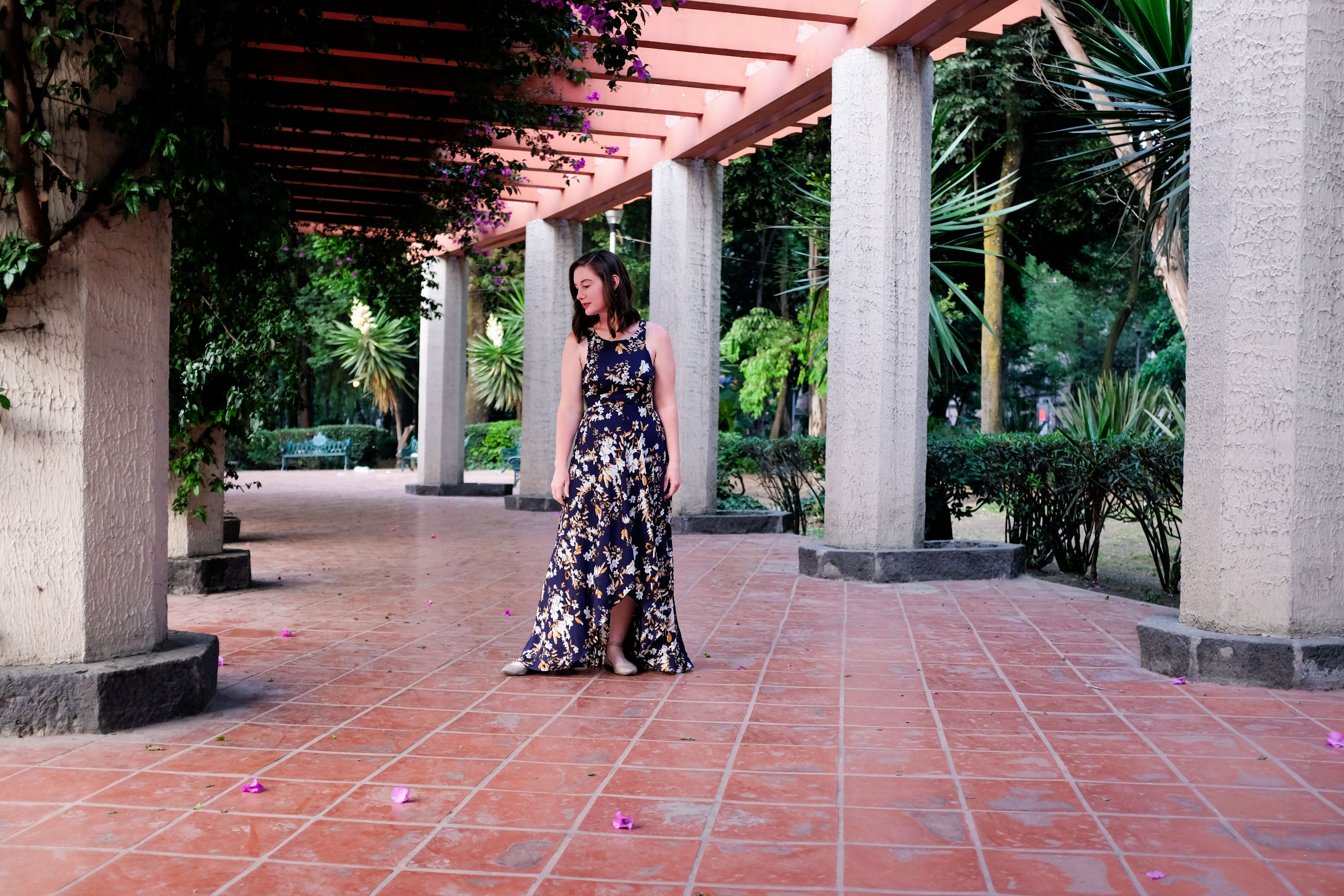 Alyssa wears a floral dress and walks through Parque Mexico 