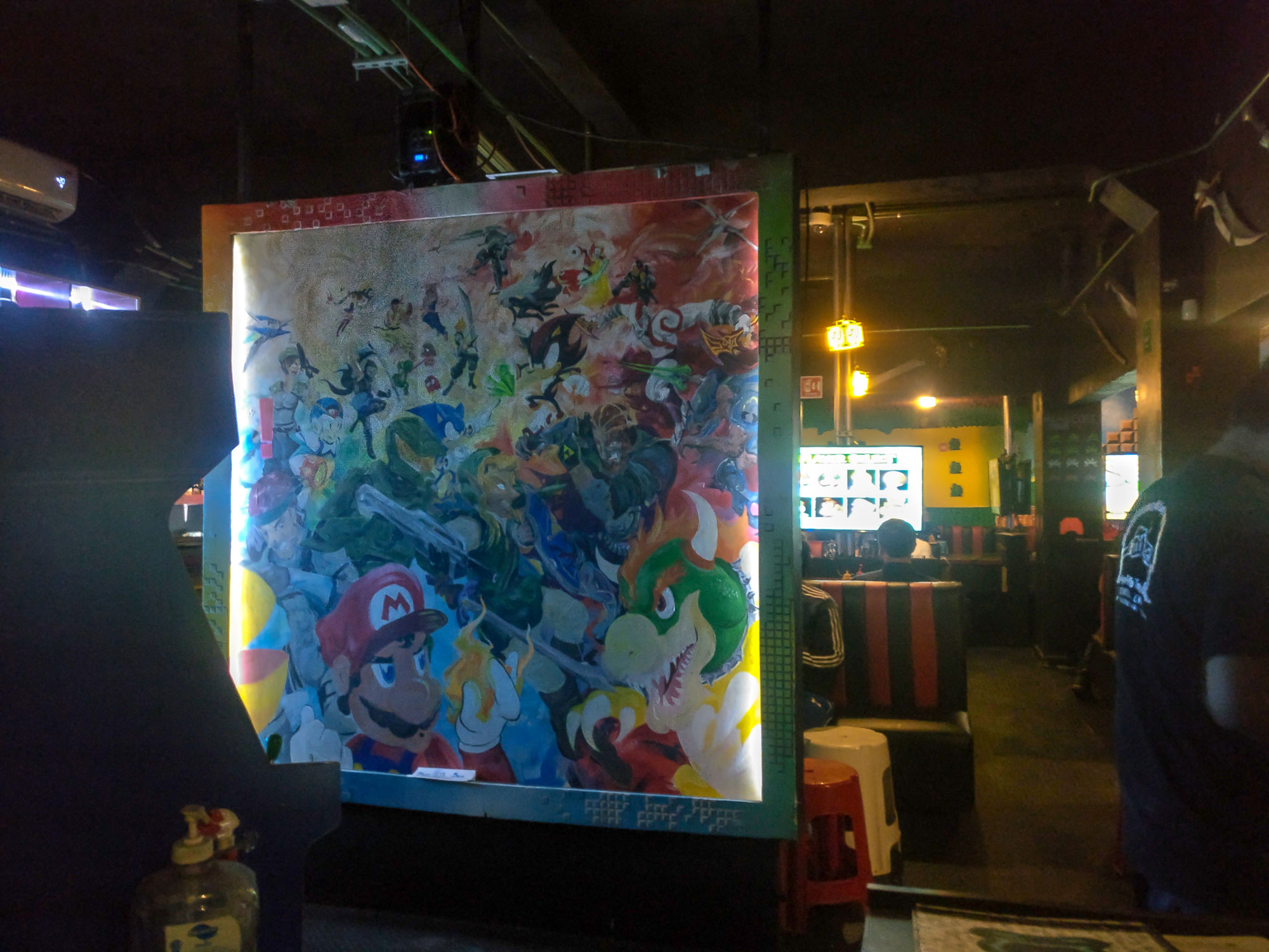 Interior of Level Up Game Bar with a mural of video game characters