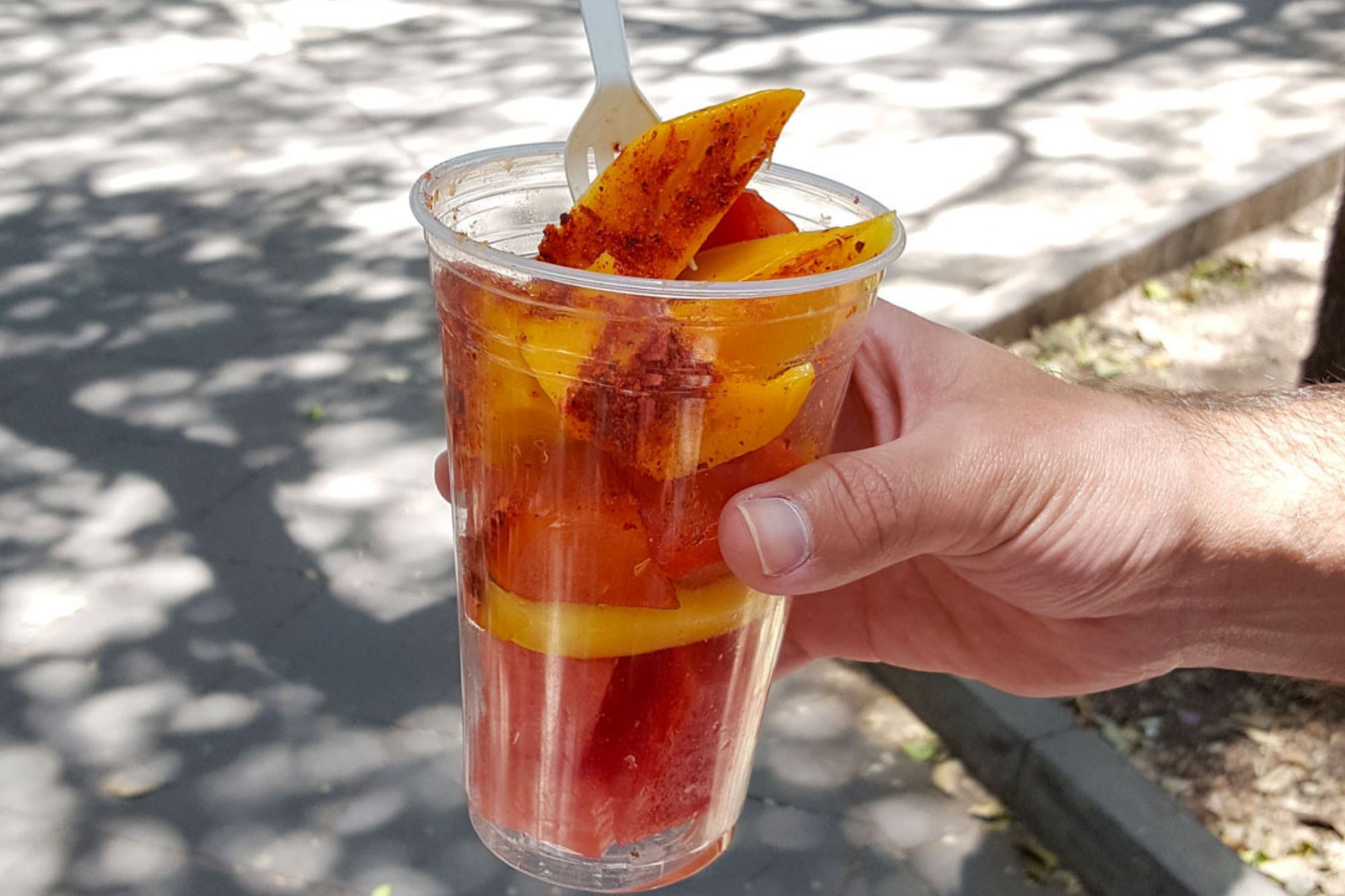 Cup of papaya and mango with chile