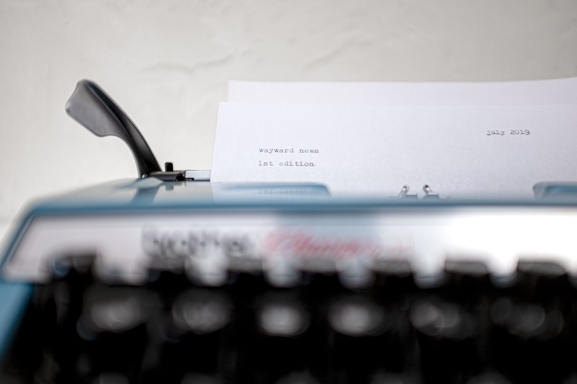 Typewriter with the words "wayward news" on the paper