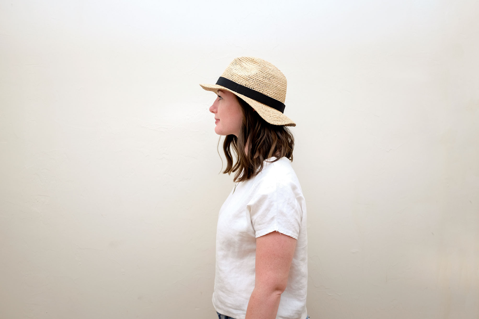 Krystal wearing the J. Crew hat, facing sideways.