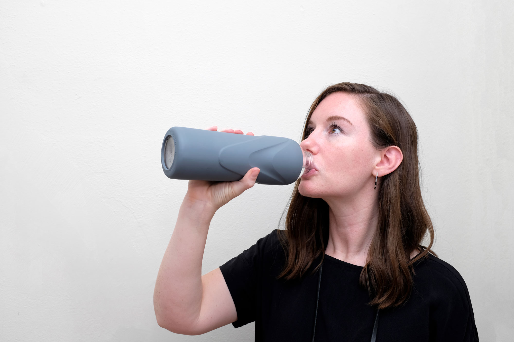 Alyssa drinking out of her glass water bottle