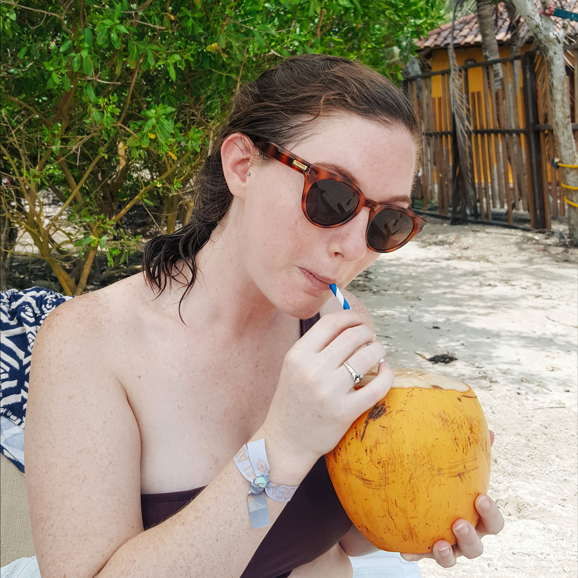 Krystal sipping from a coconut