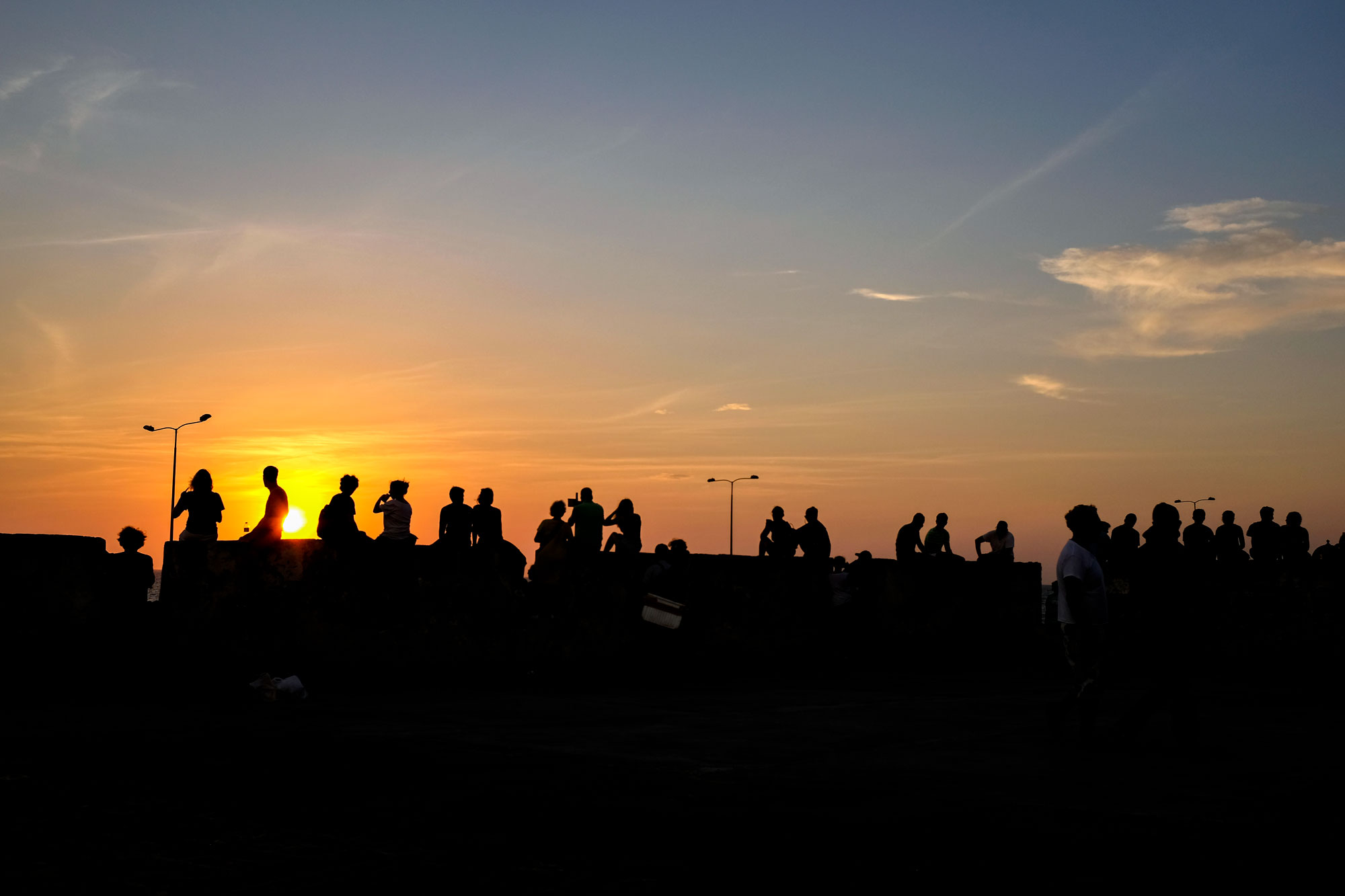Silhouette of people watching the sunset in Cartagena