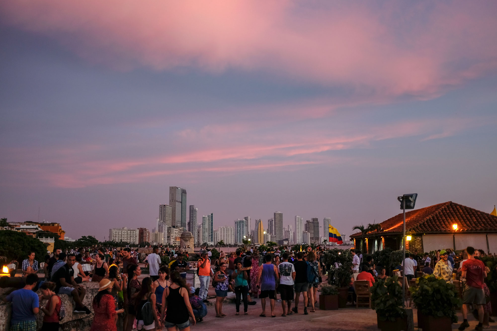 Crowd in front of Cafe del Mar - the city skyline is in the background