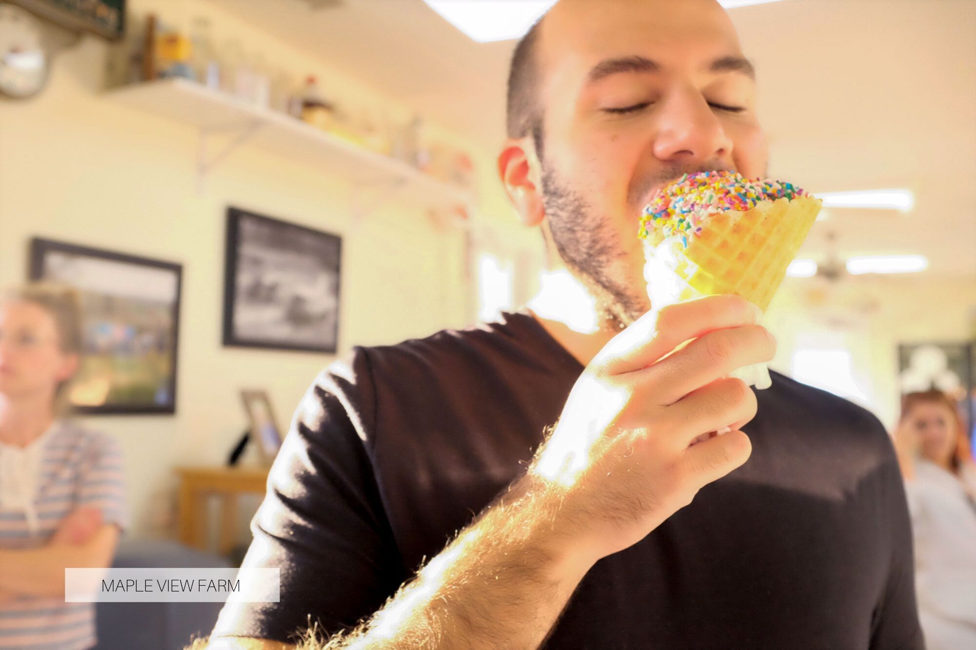 Michael eating an ice cream cone with sprinkles