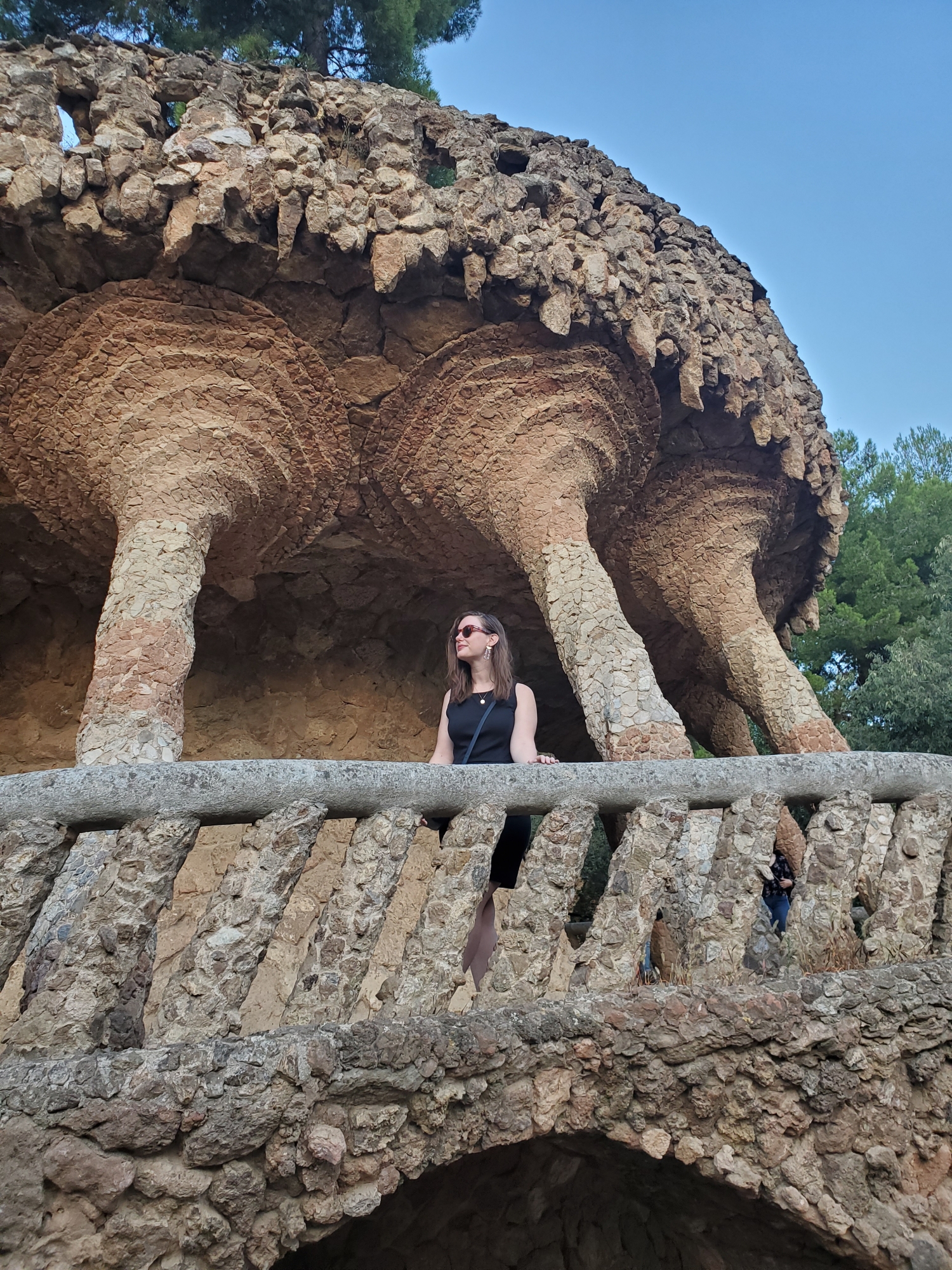 Alyssa stands on a balcony in Park Guell