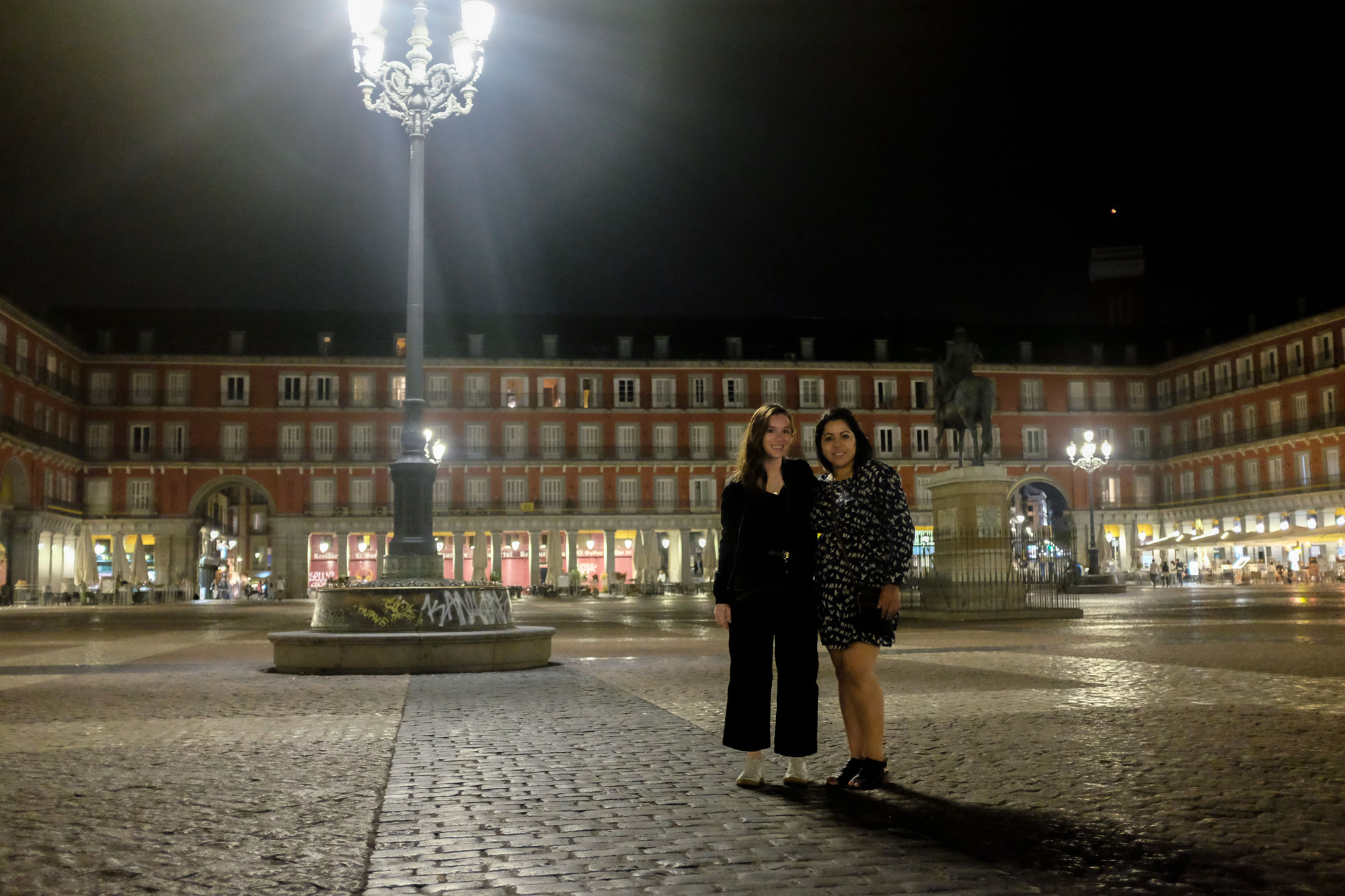 Alyssa and Michael's sister in the plaza mayor after dark