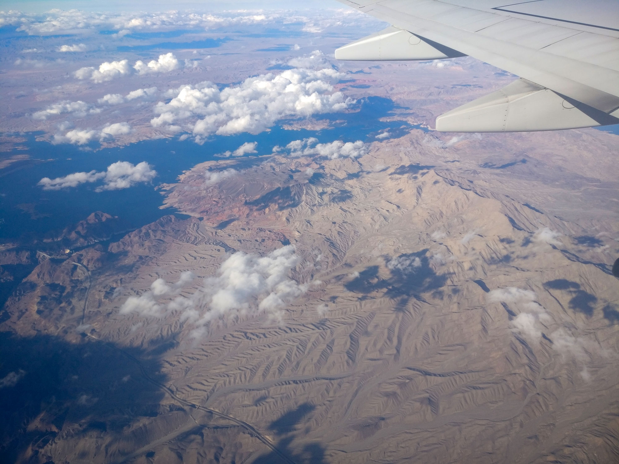 View out of an airplane window over mountains