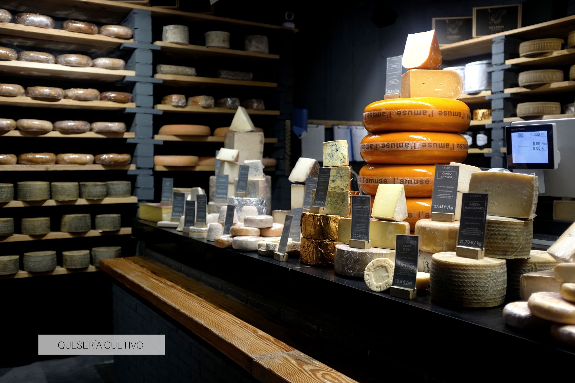 The large counter of cheeses at Quesería Cultivo