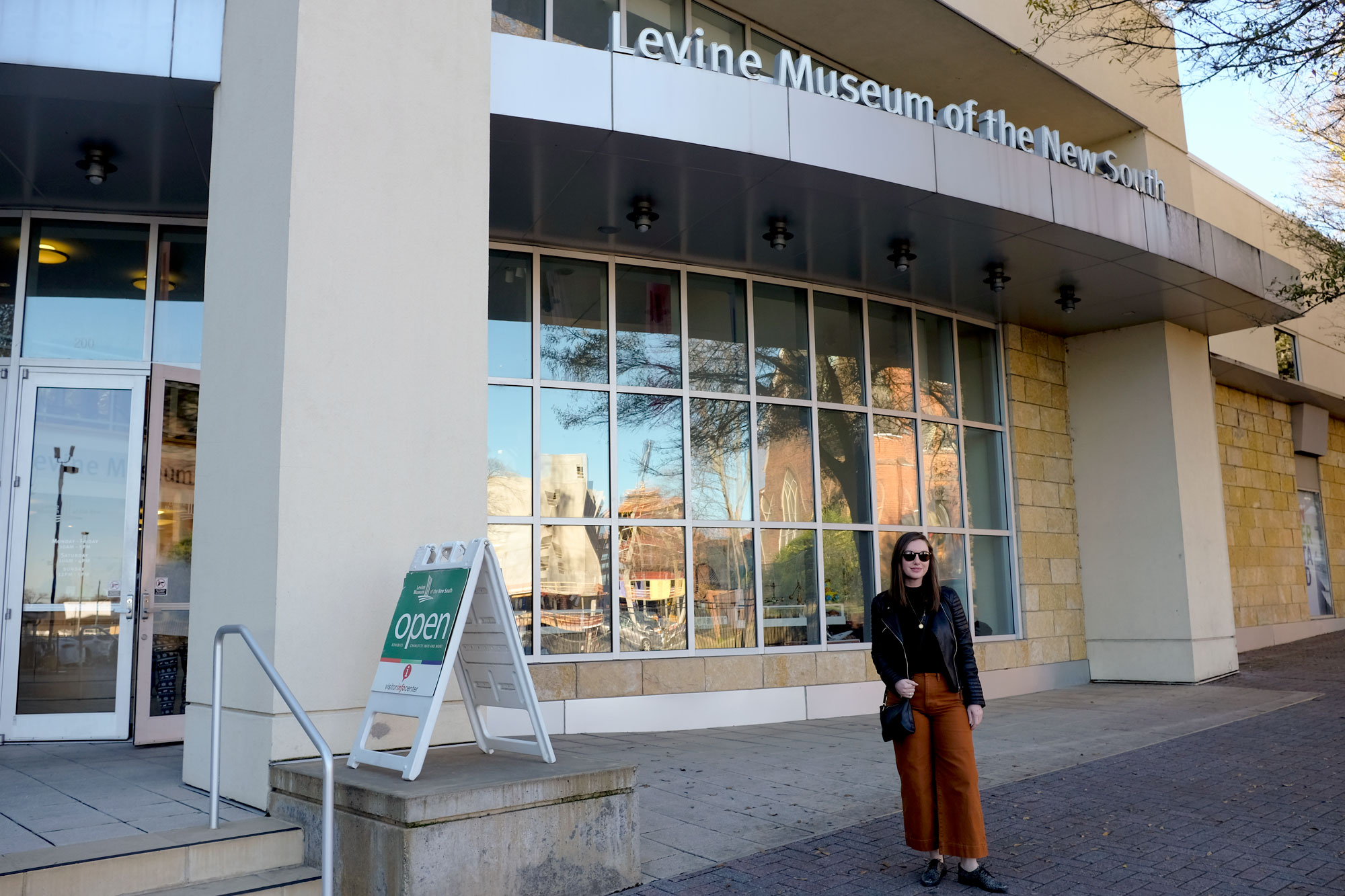 Alyssa standing in front of the Levine Museum of the New South