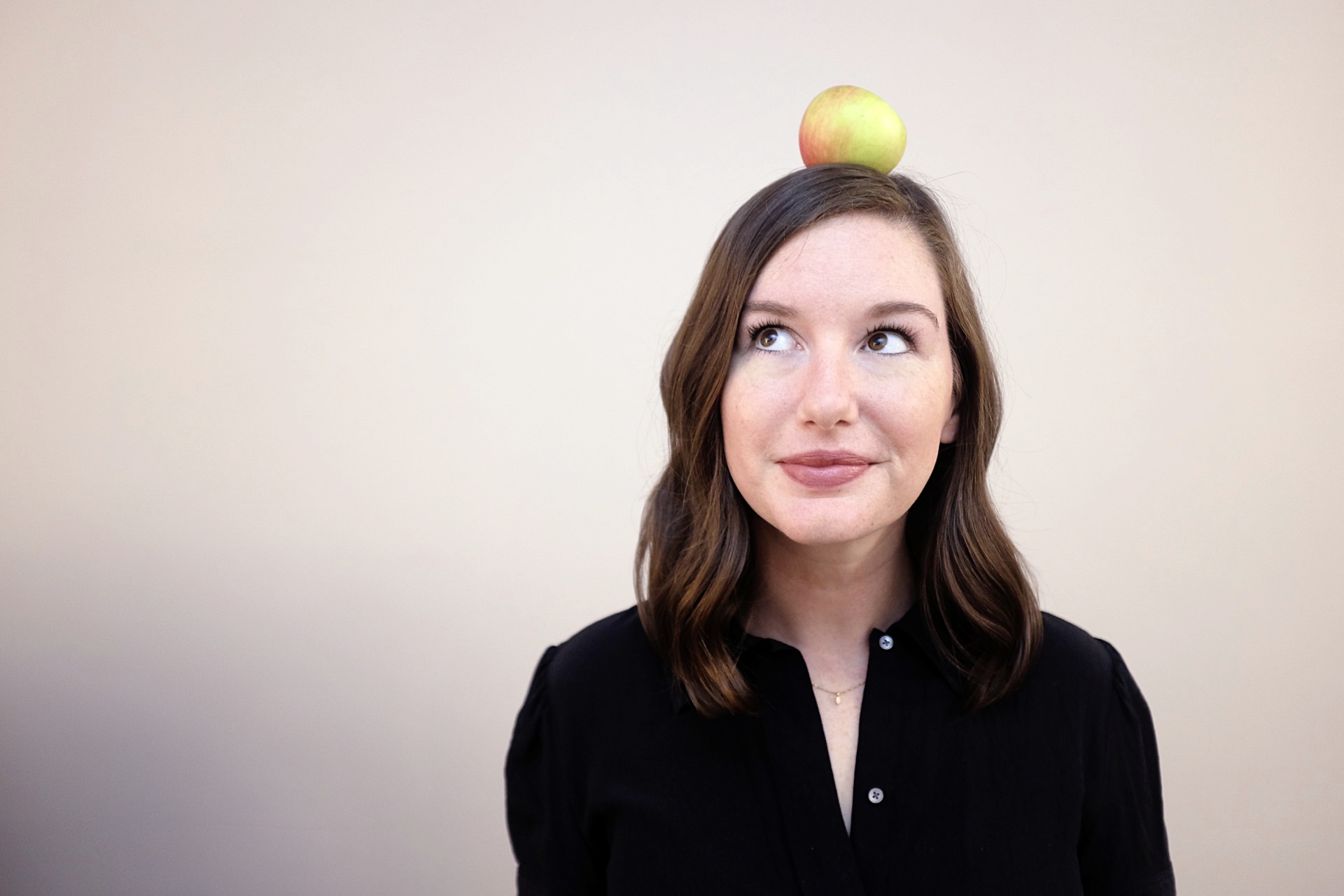 Alyssa with an apple on her head