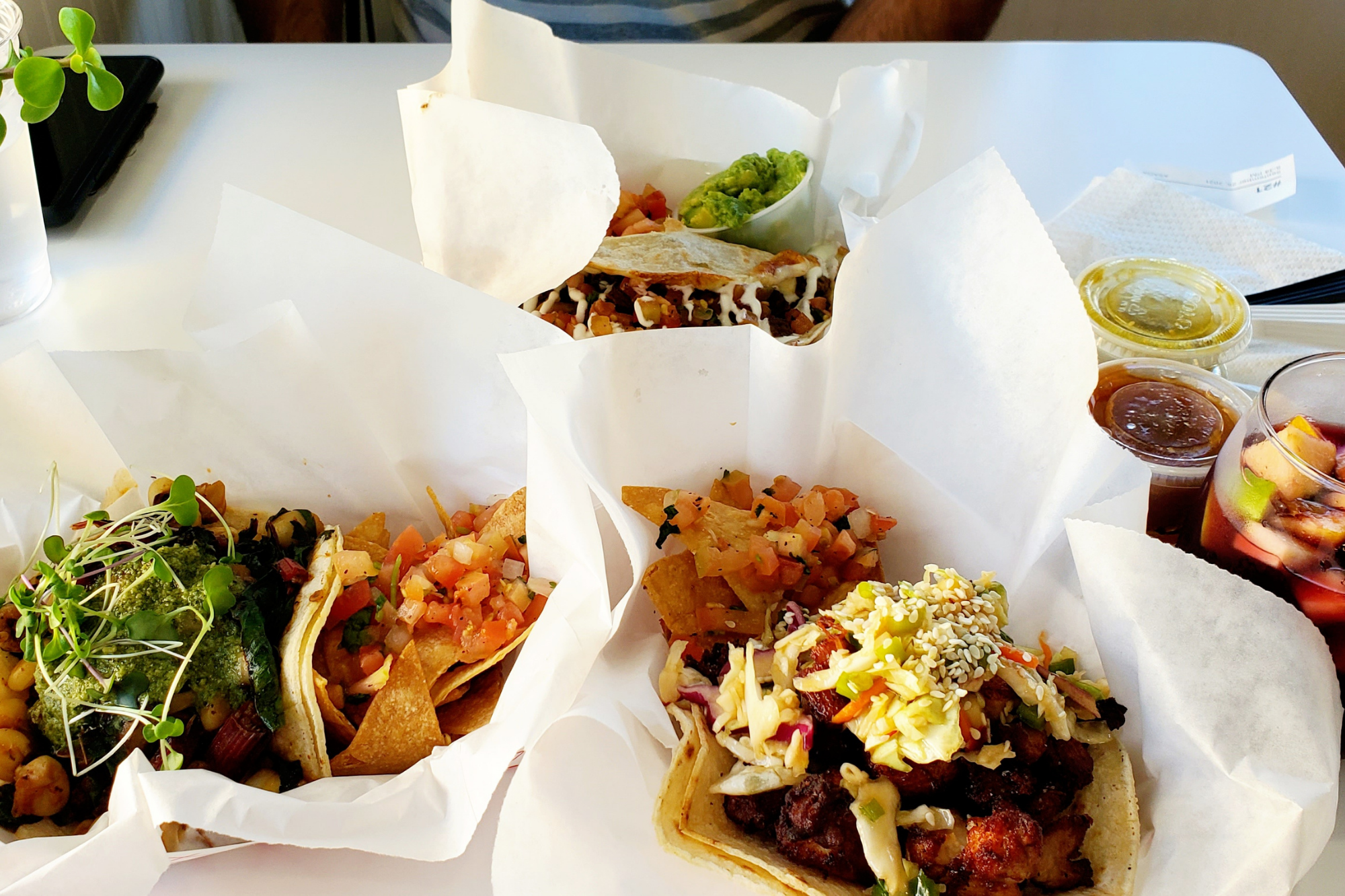 Meal at Asada: a table with tacos, chips, and a quesadilla