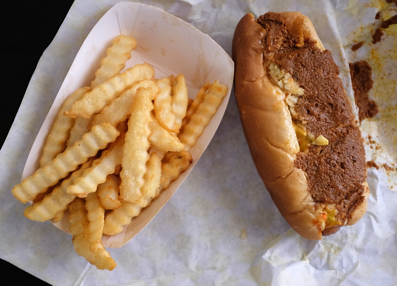 Hot dog with chili and a side of french fries