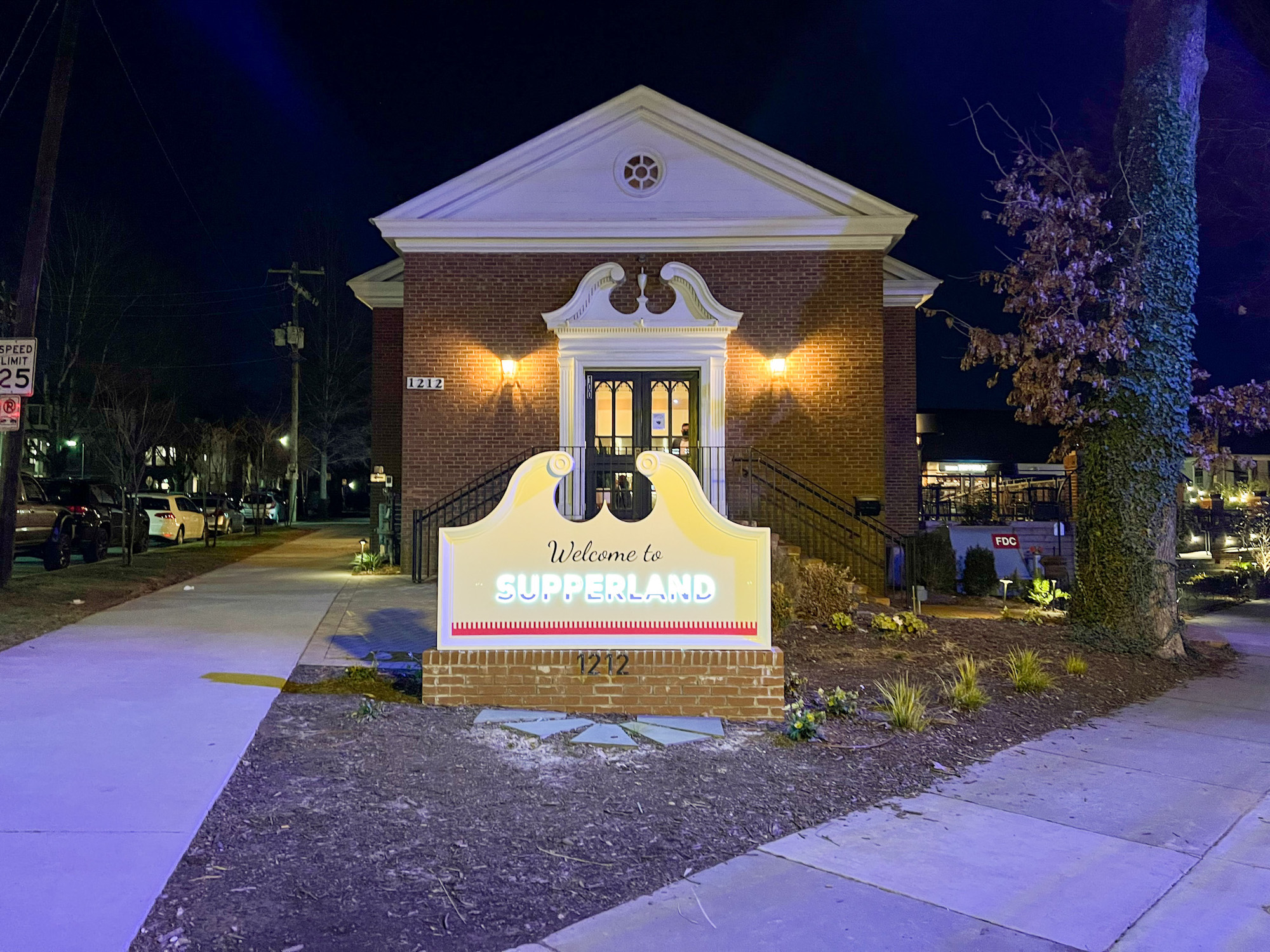 Exterior of Supperland after dark