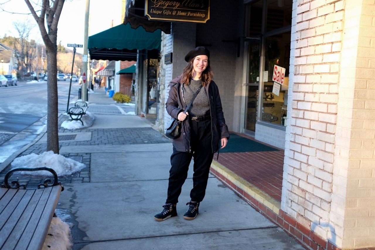 Alyssa stands in front of a shop in downtown Blowing Rock