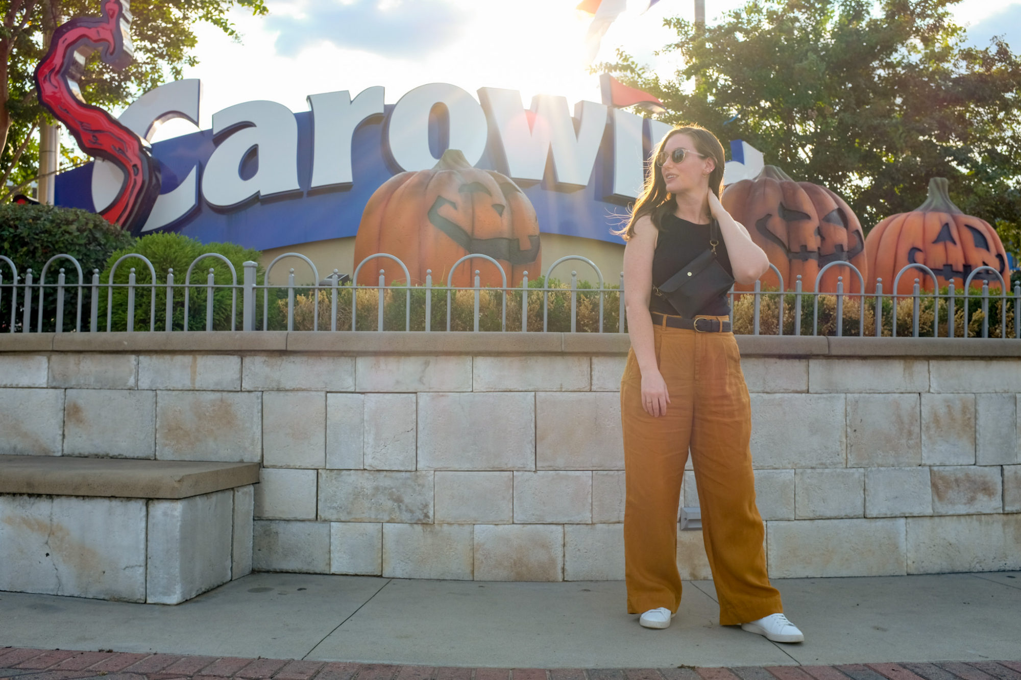 Alyssa stands in front of the SCarowinds sign