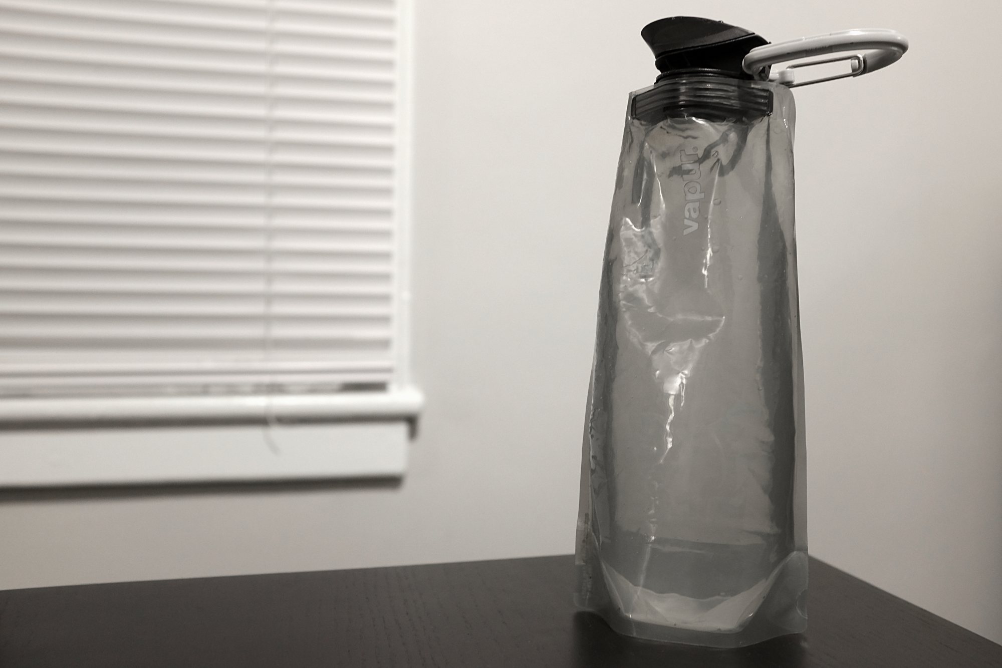a vapur water bottle sits on a table