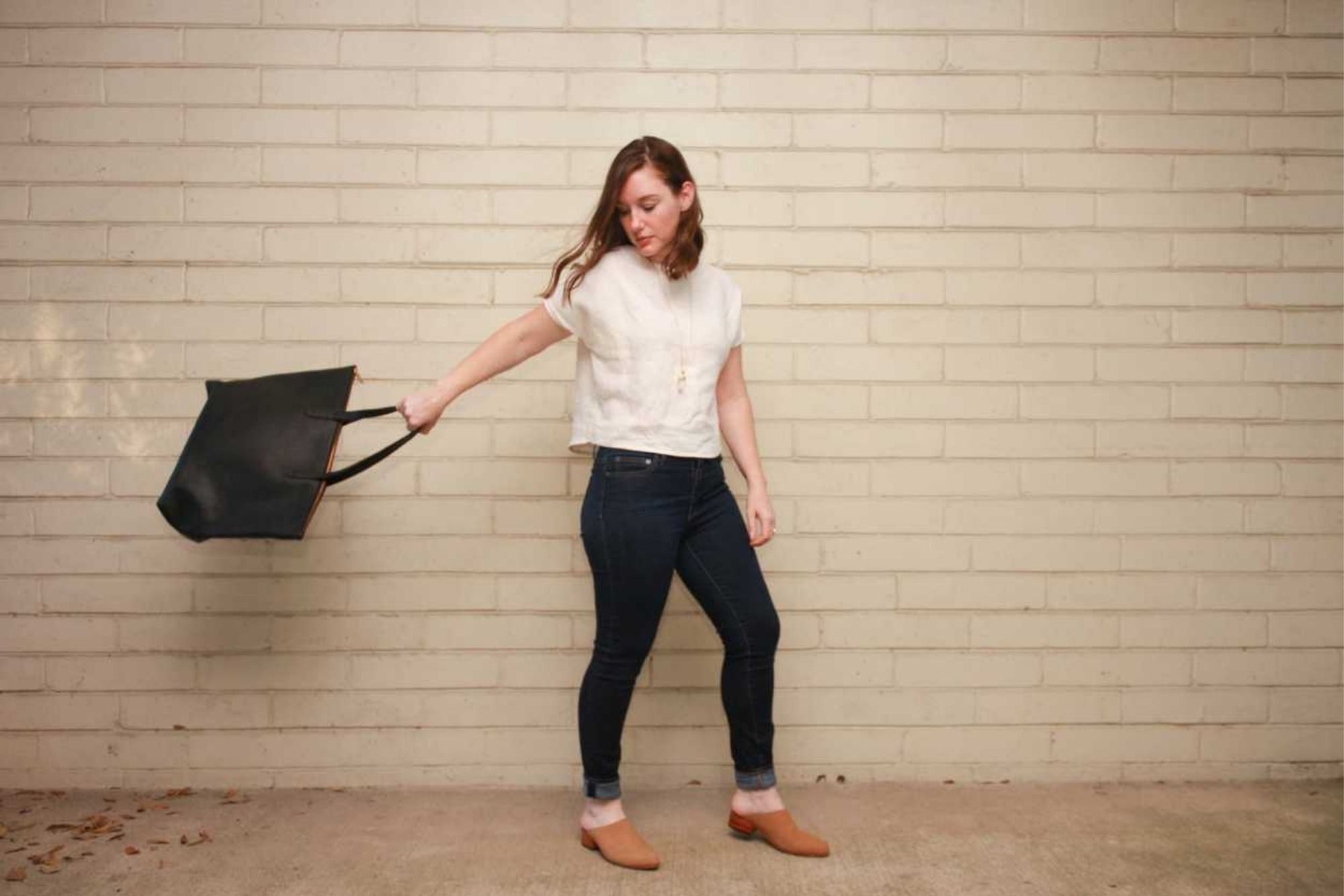 An old photo - Alyssa swings the tote behind her