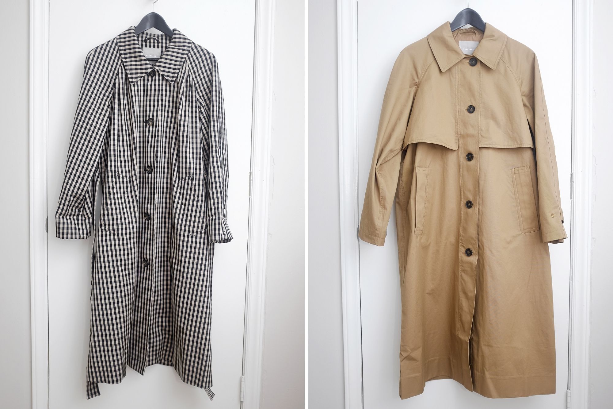 both trench coats hang on a closet door
