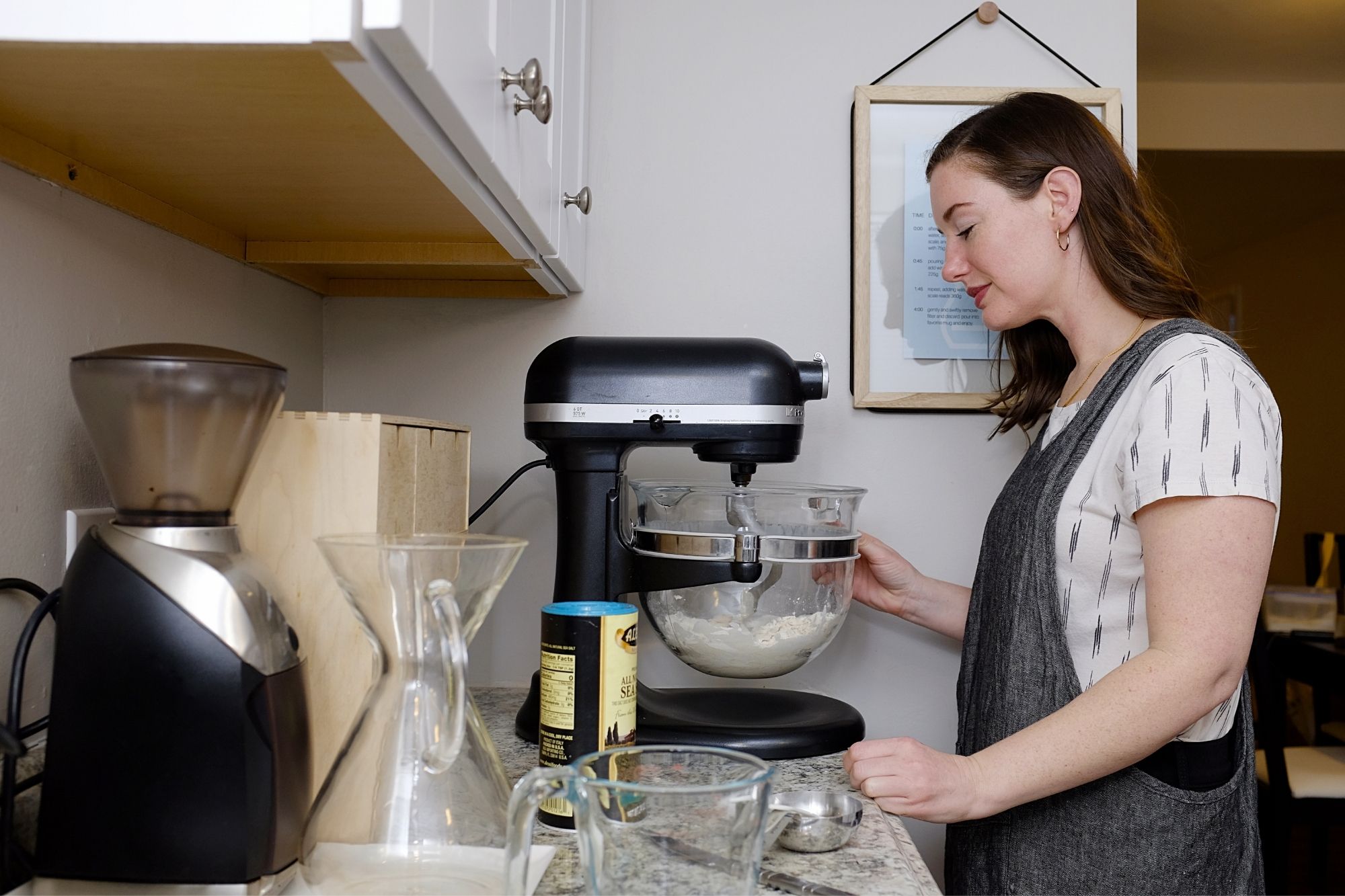 Alyssa makes pizza dough in a stand mixer