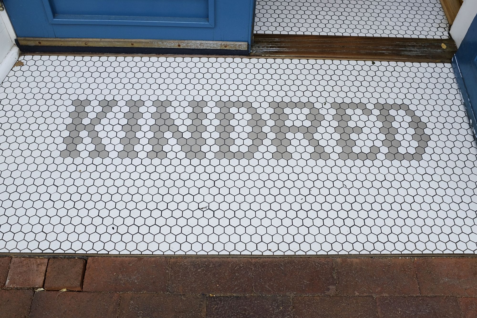 Tiled entrance that reads "KINDRED"