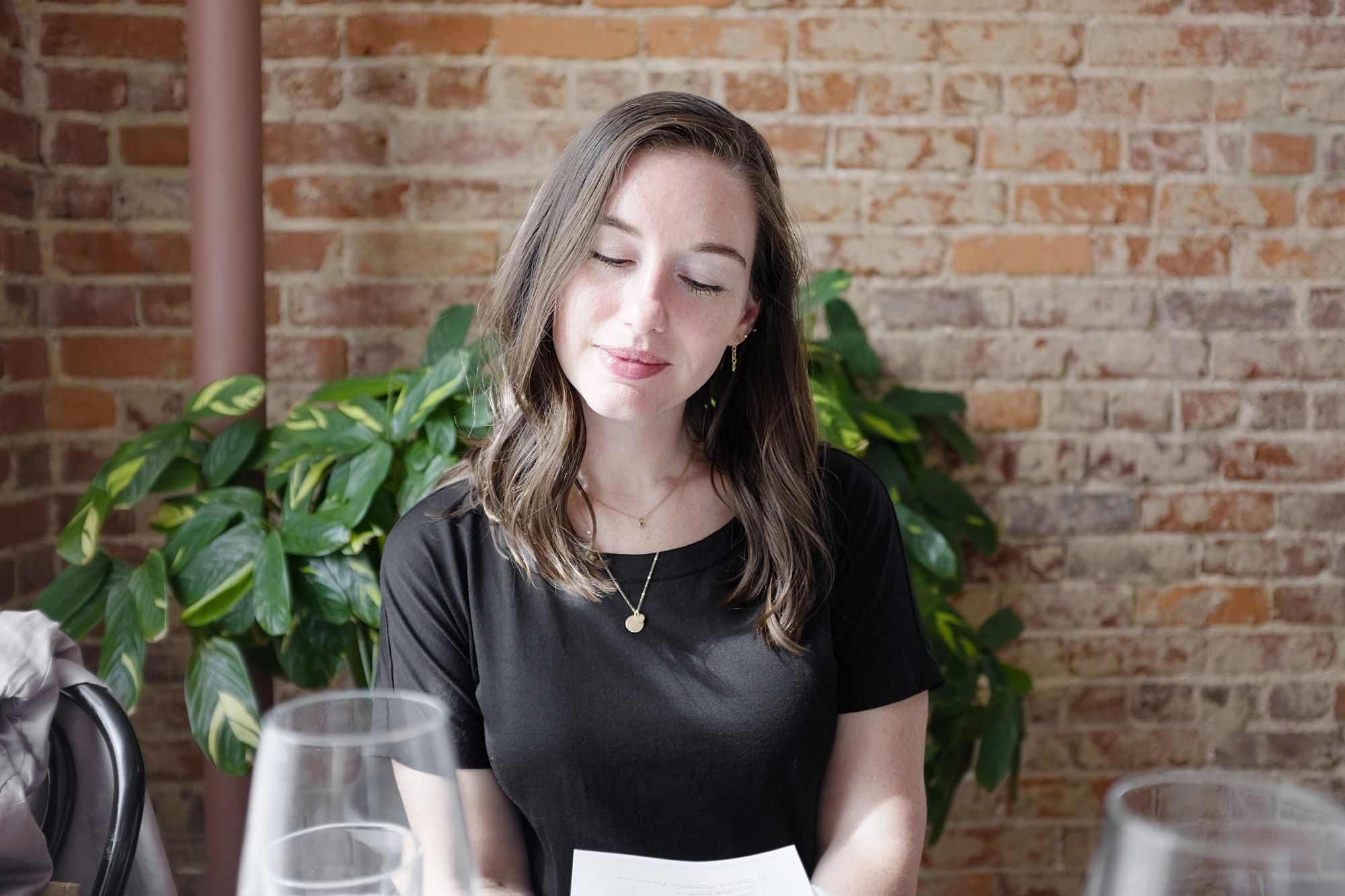 Alyssa sits at a table at Kindred