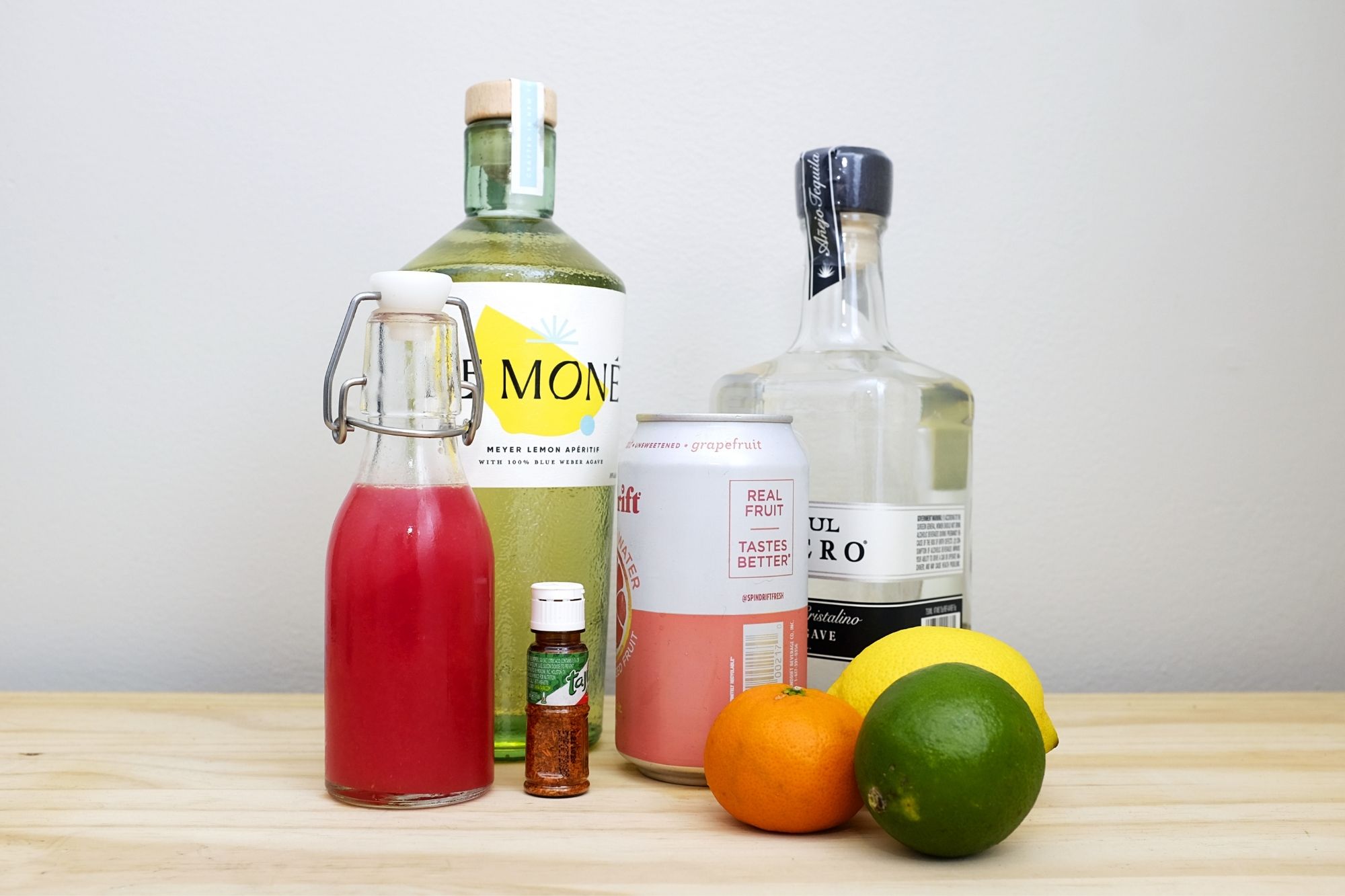 Ingredients for the recipe: Le Mone, tequila, juice, grapefruit soda, Tajin, and citrus