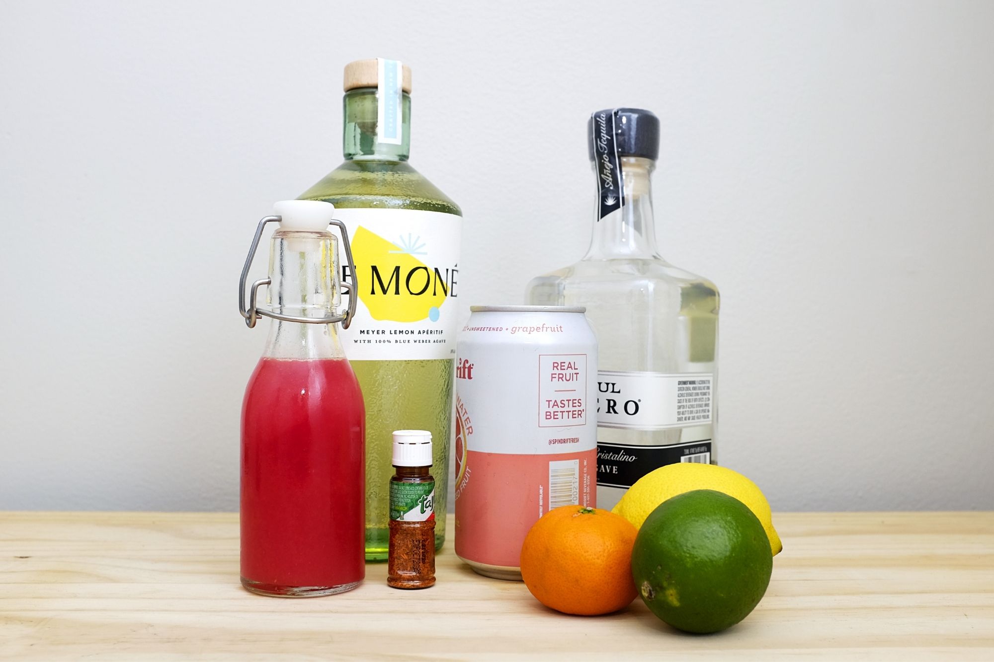 Ingredients for the recipe: Le Mone, tequila, juice, grapefruit soda, Tajin, and citrus