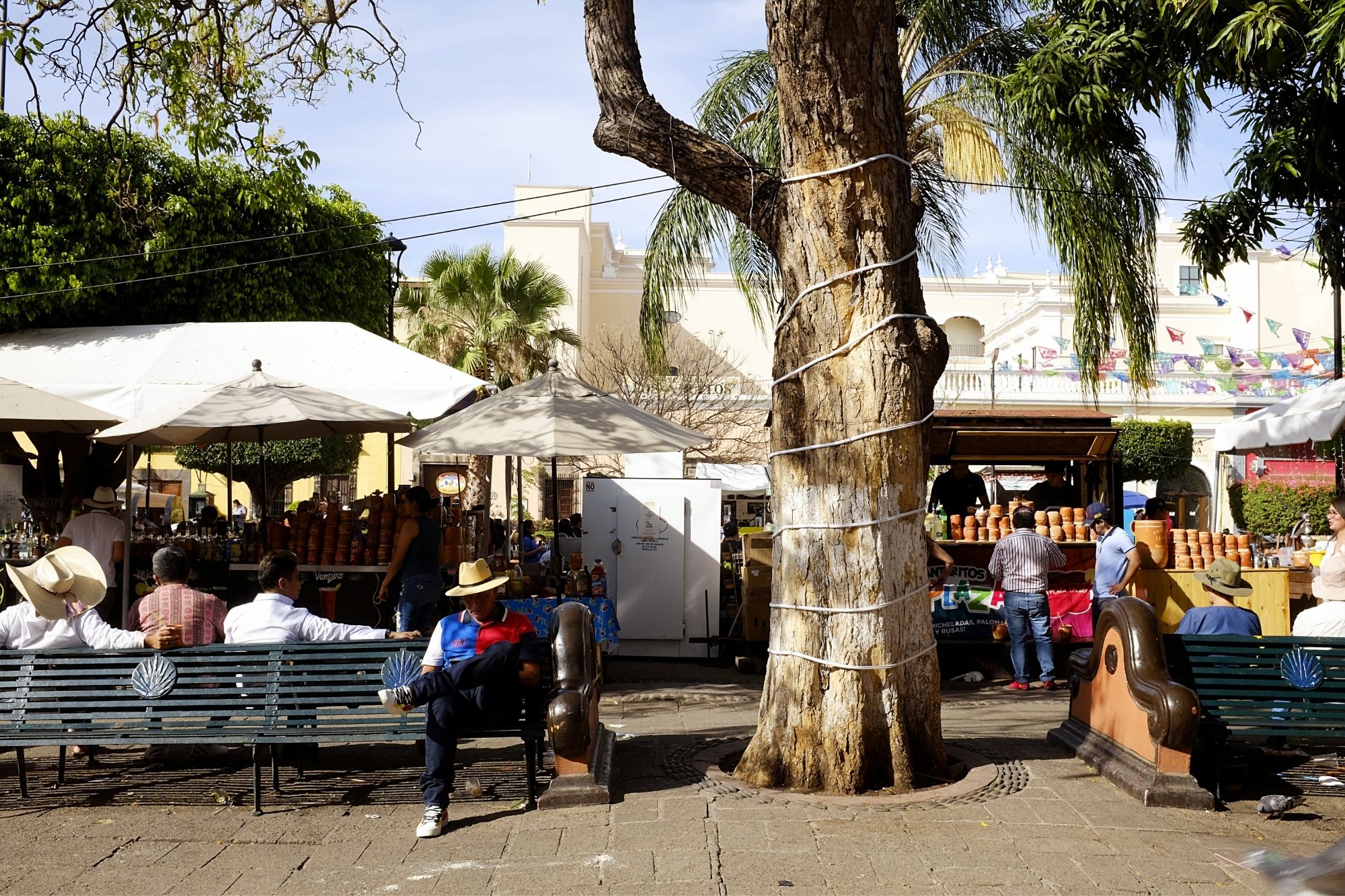 A crowd gathers in a square in the city center of Tequila