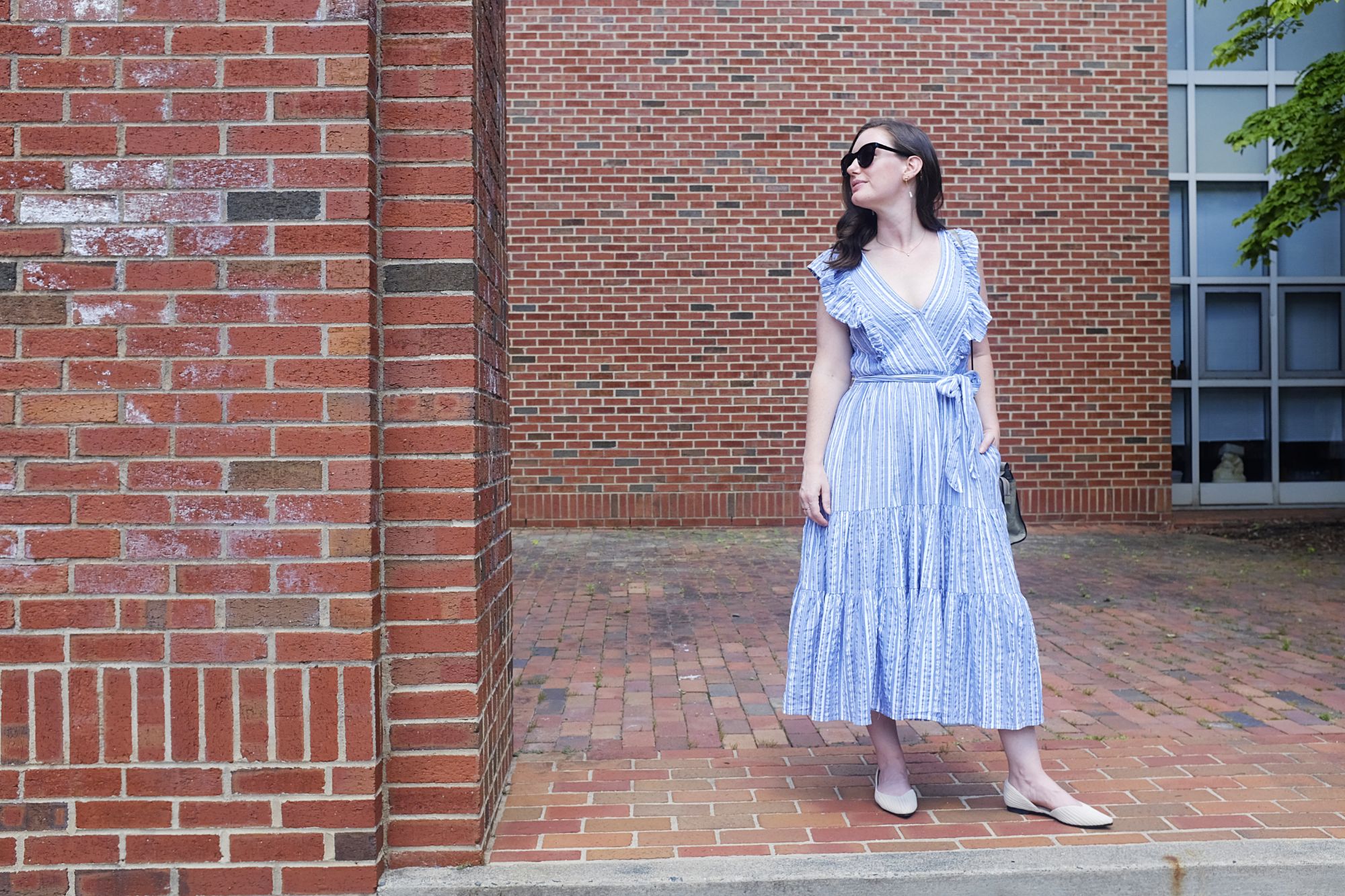 Alyssa stands in a brick archway