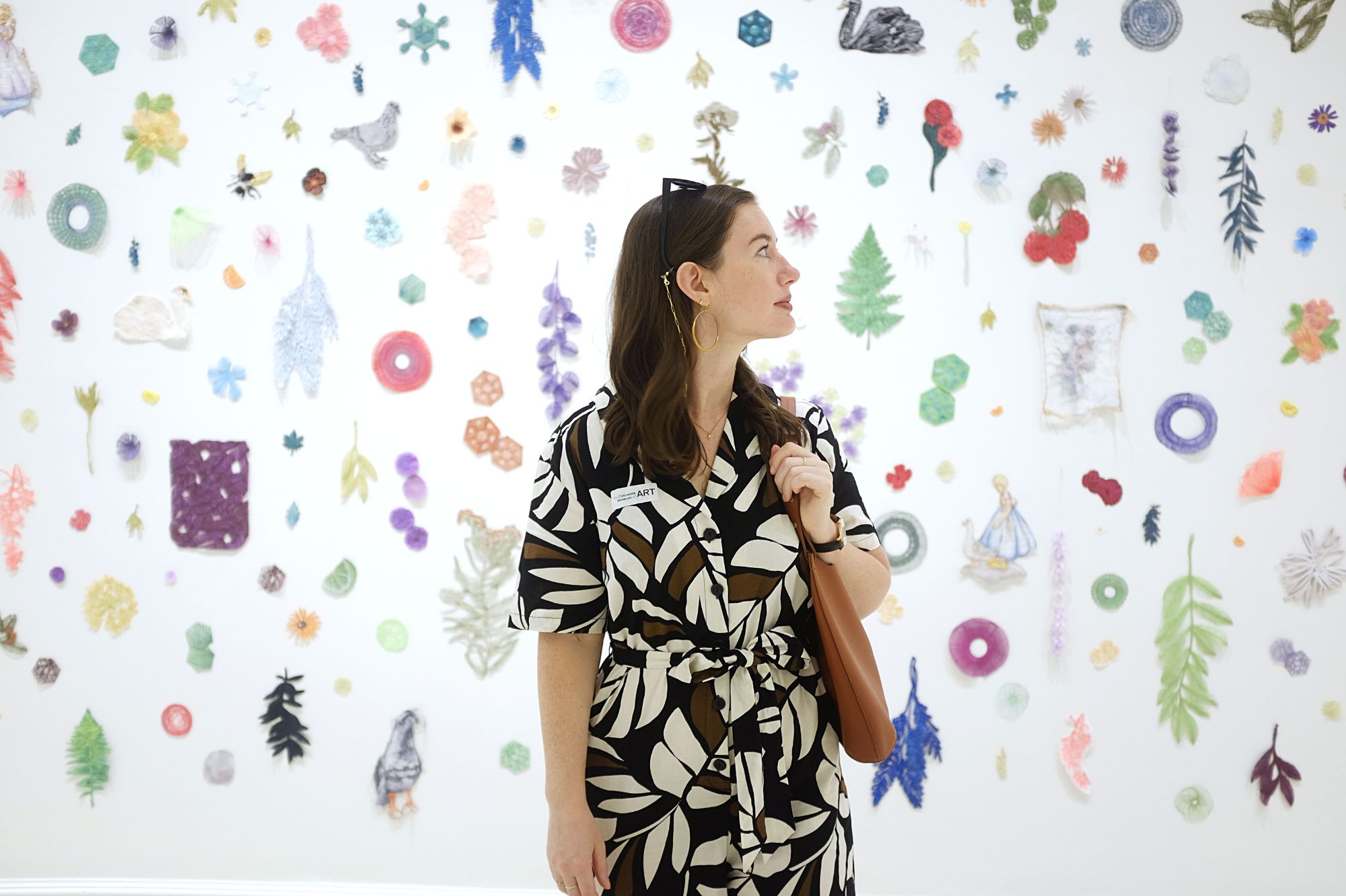 Alyssa stands in front of an exhibit at Columbia Museum of Art