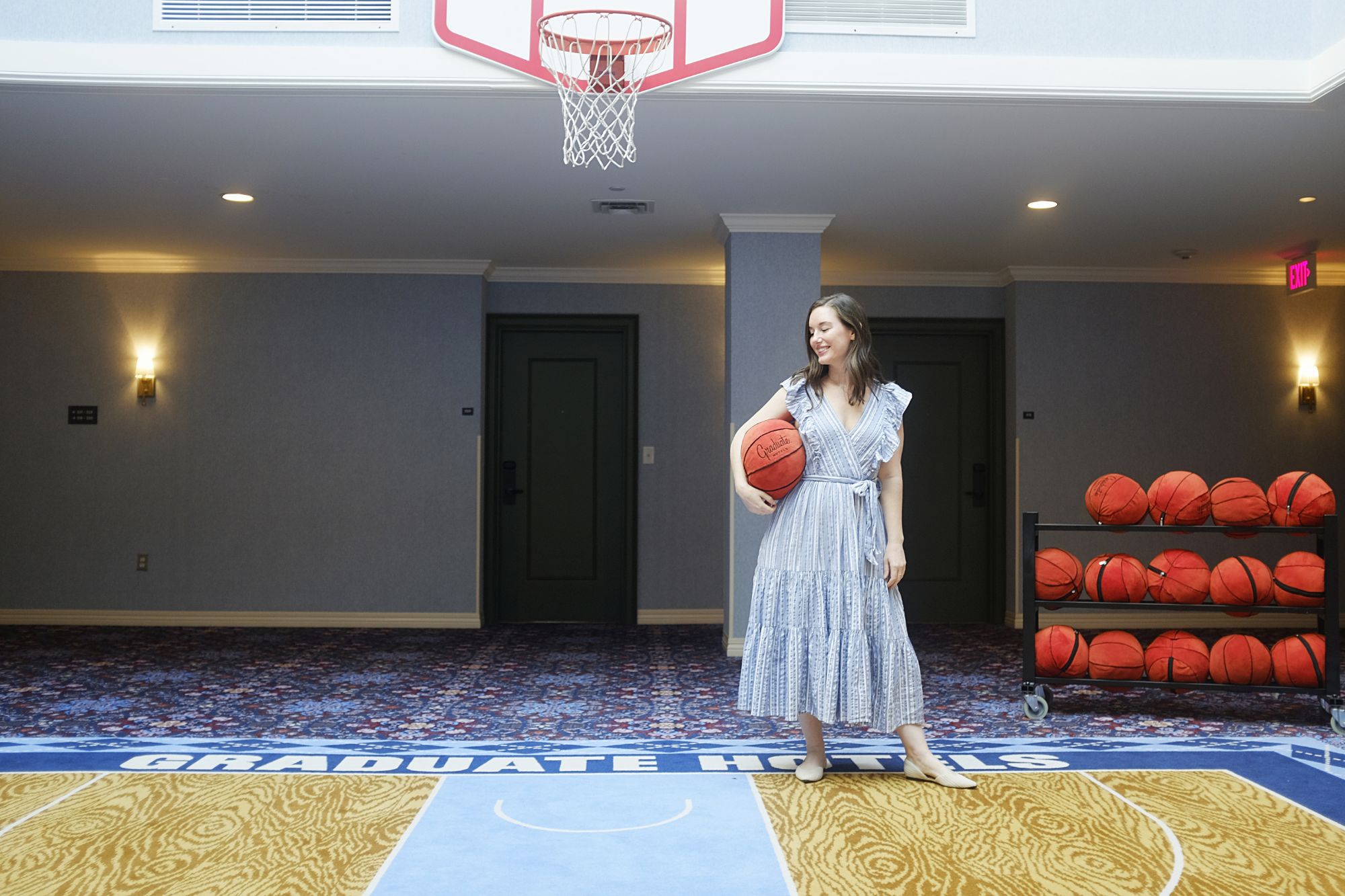 Alyssa holds a plush basketball at Graduate Chapel Hill