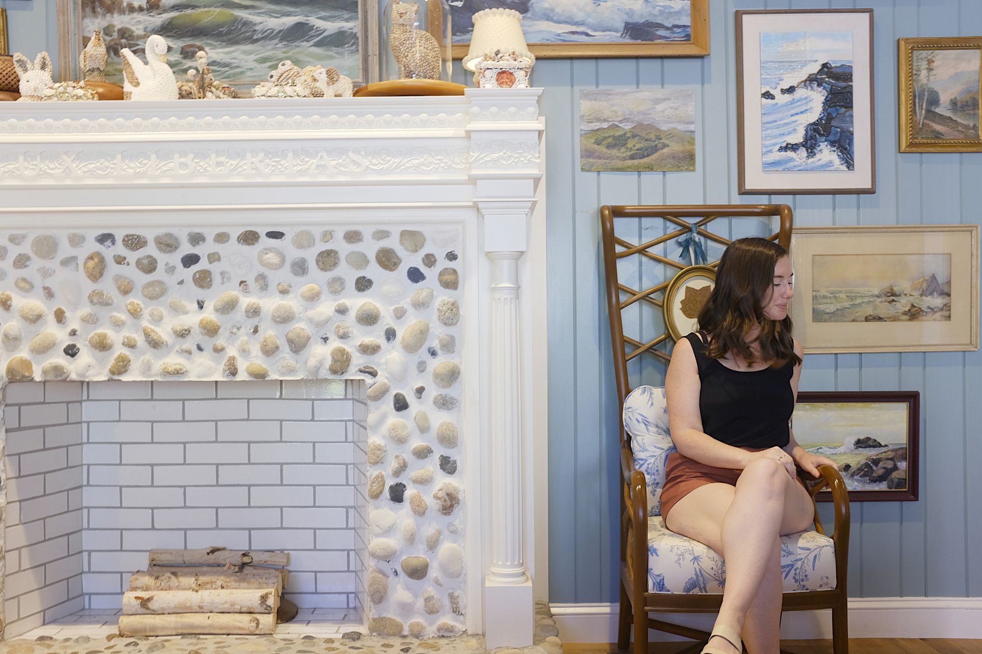 Alyssa sits in a chair in the Graduate Hotel lobby