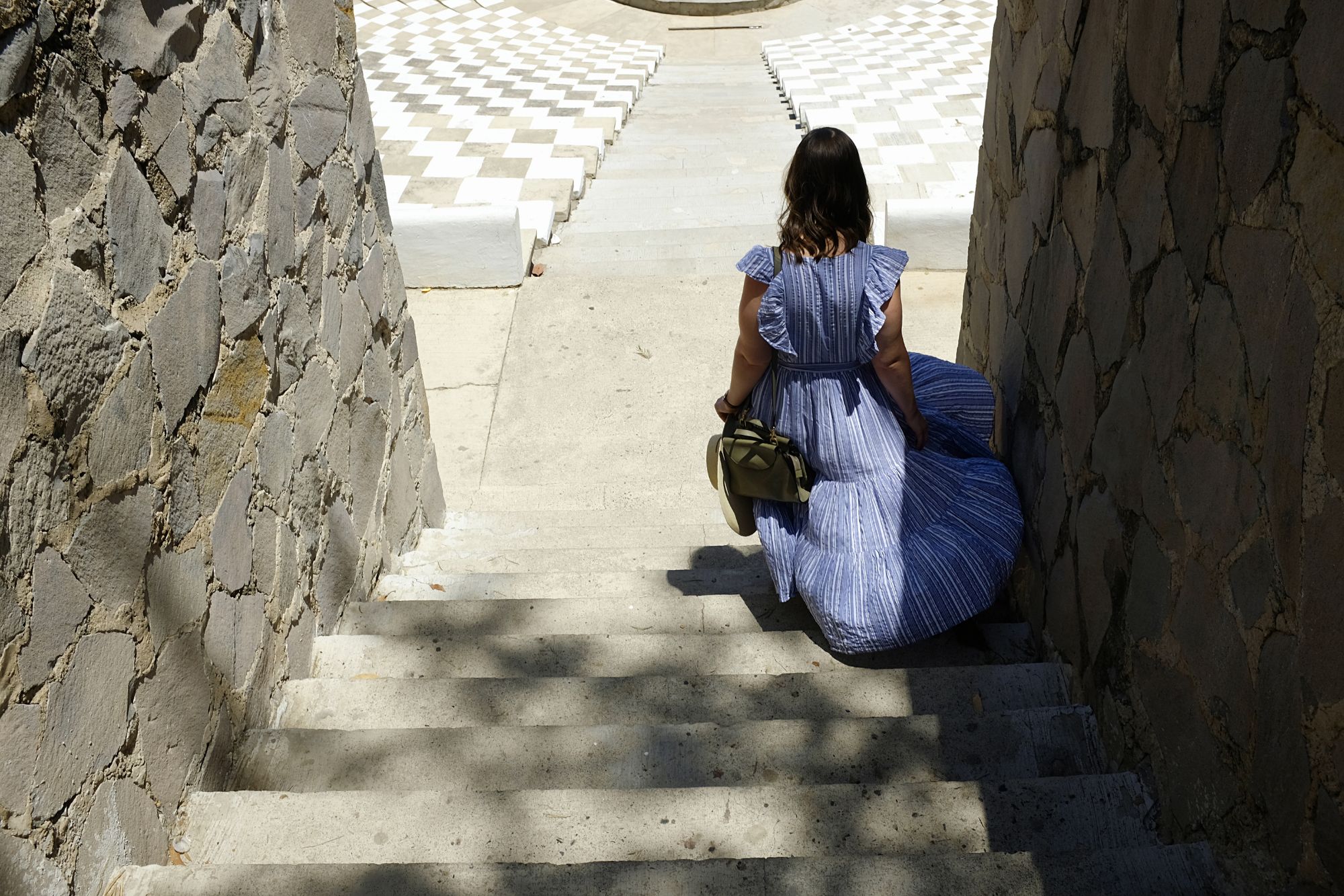 Alyssa walks down the stairs at Guadalajara's Parque Mirador Independencia 