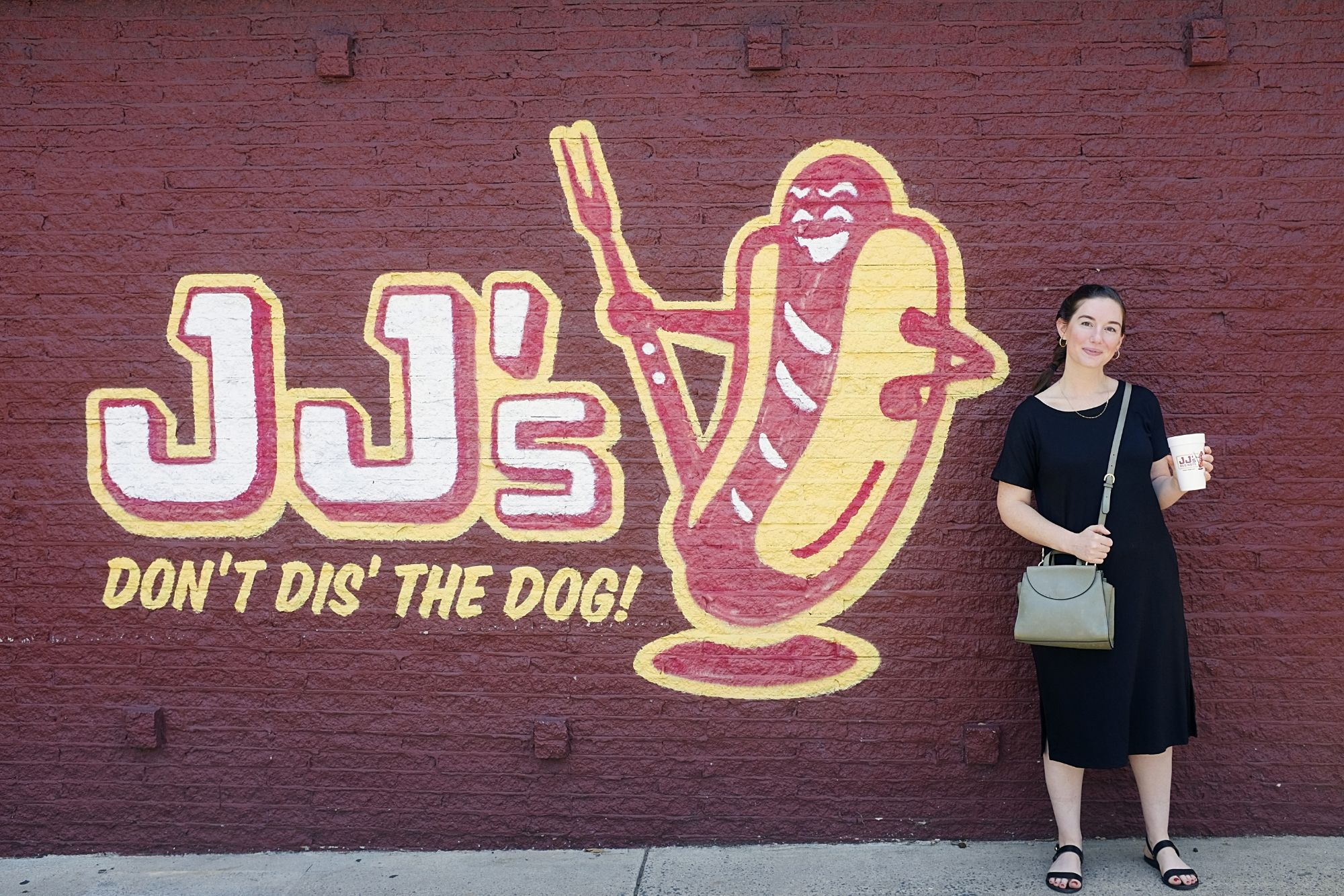 Alyssa stands in front of JJ's Red Hots